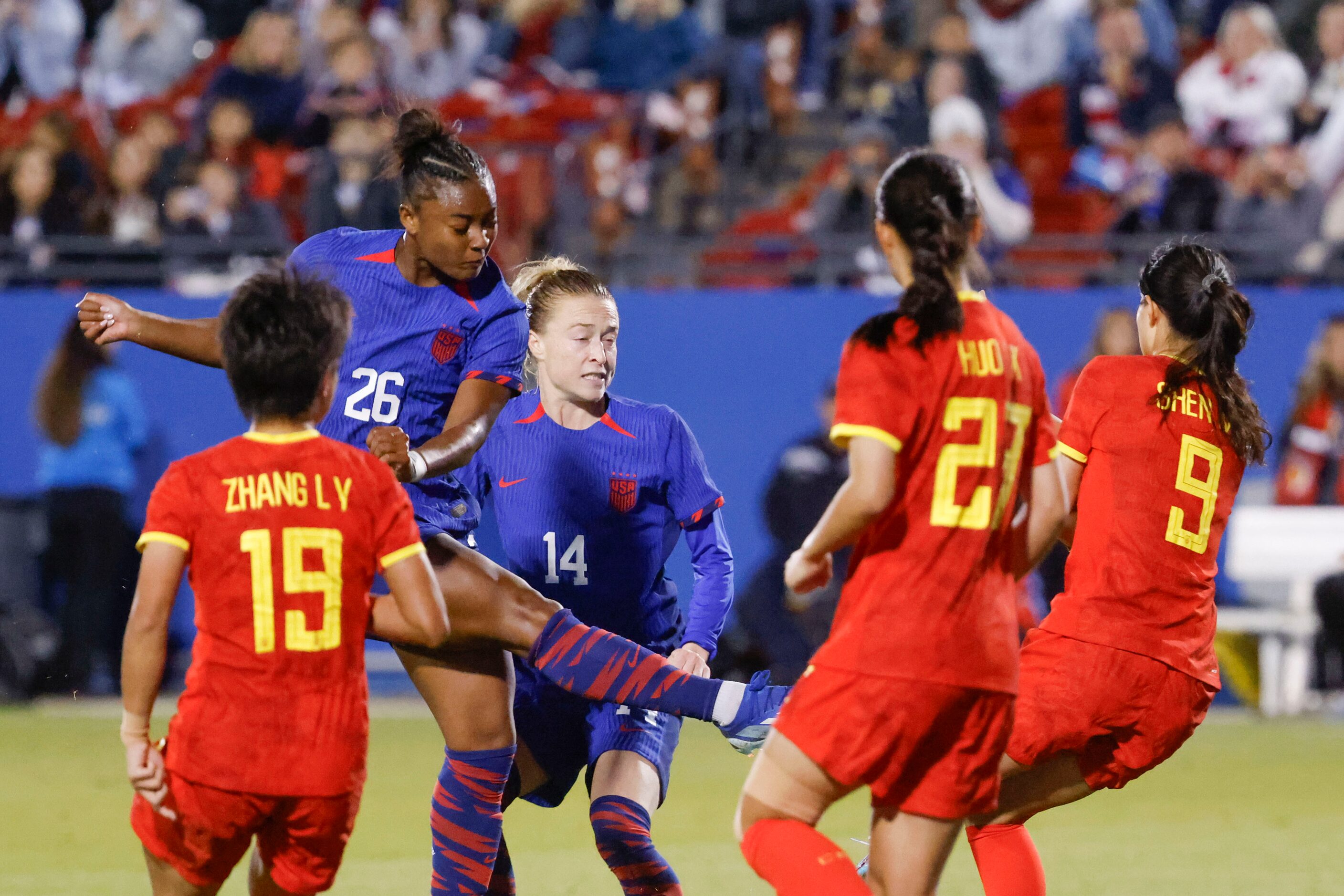 Untied State’s Jaedyn Shaw (26) shoots for a goal pas China’s defenders during the second...