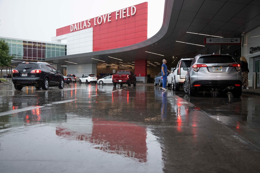 Rain falls as storms move through North Texas at Dallas Love Field on Thursday, May 30,...