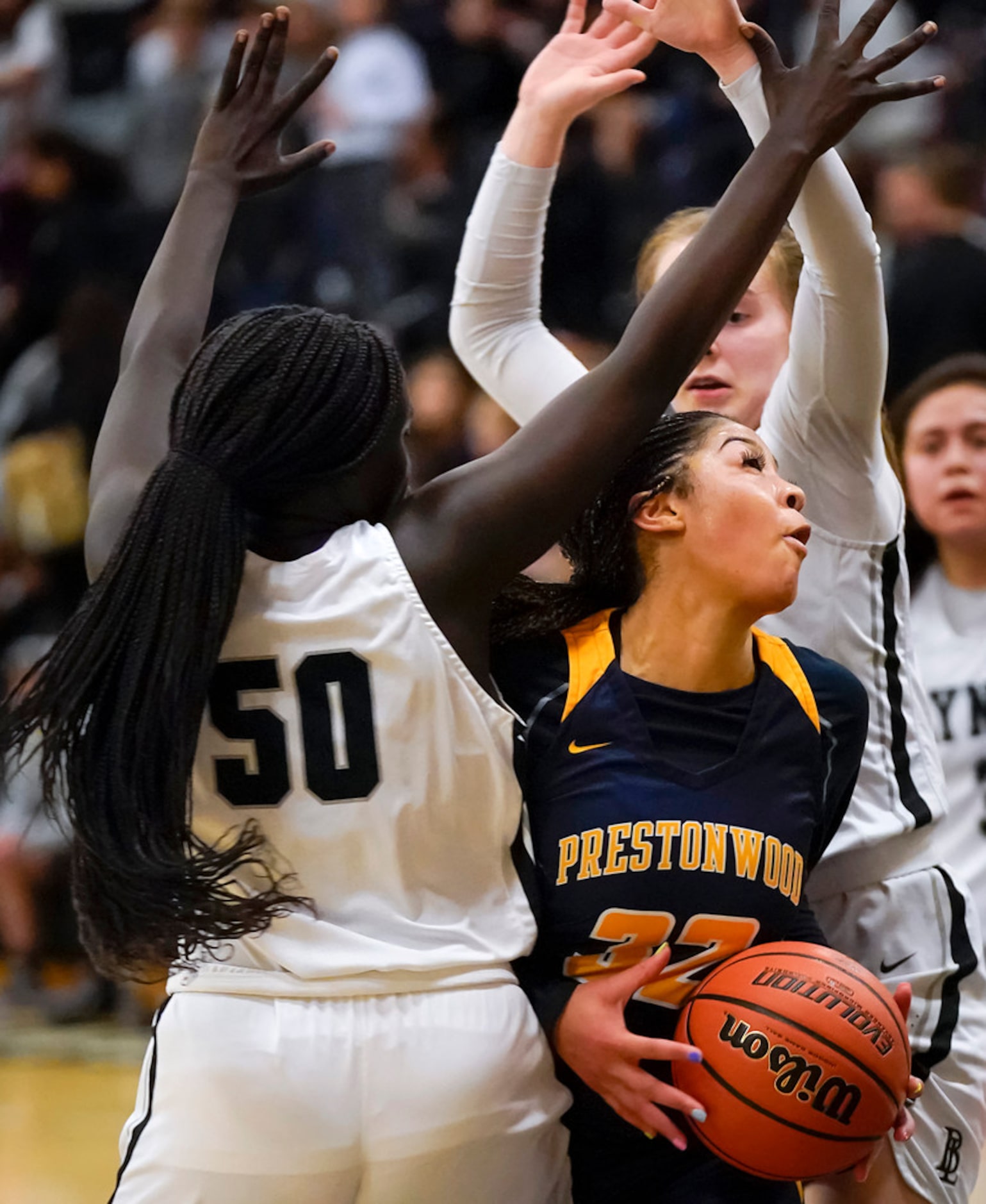 Prestonwood Christian guard Jordan Webster (32) tries to drive between Bishop Lynch guard...