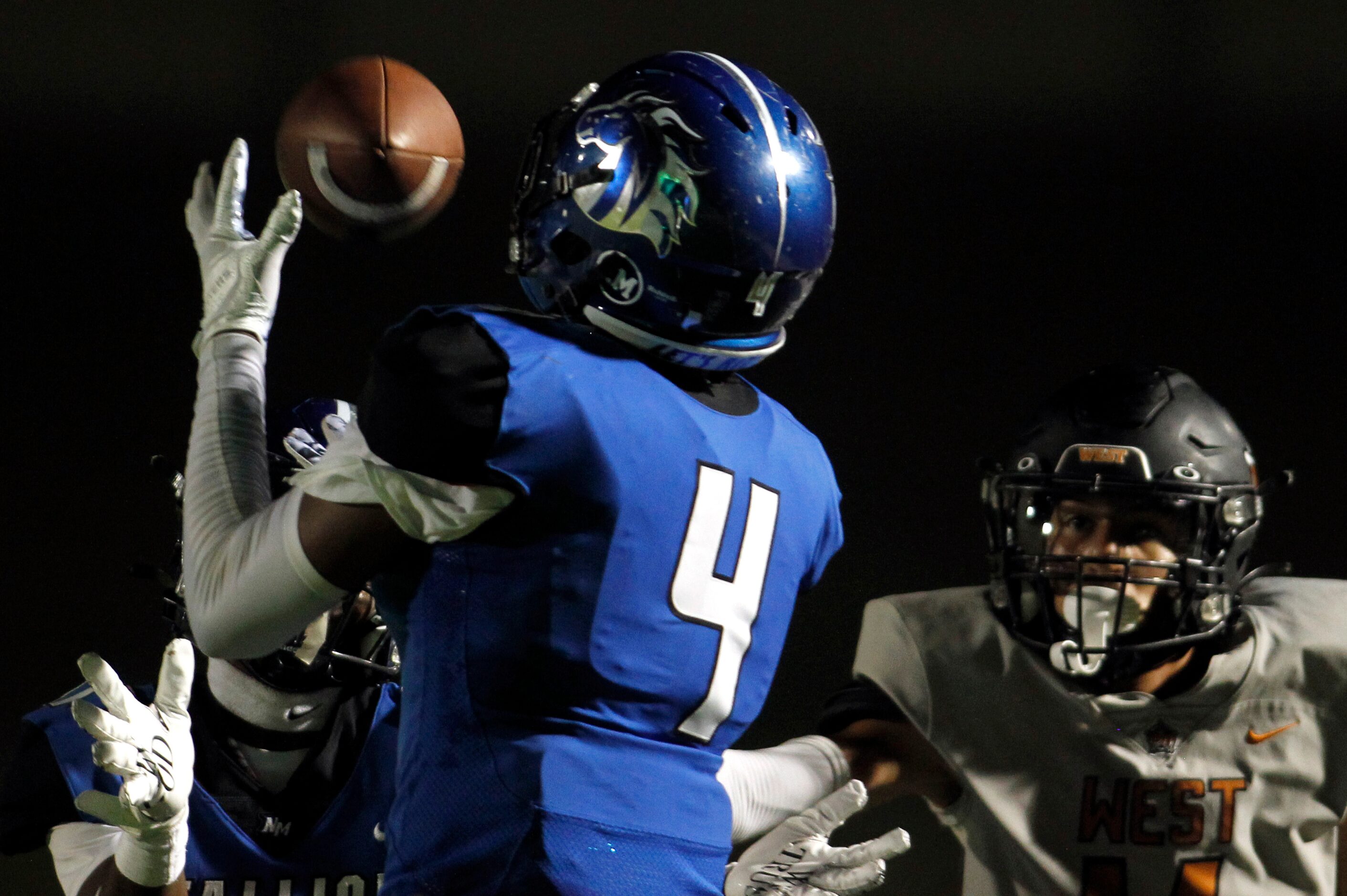 North Mesquite defensive back Kyreese Massey (4) pulls in an interception as West West...