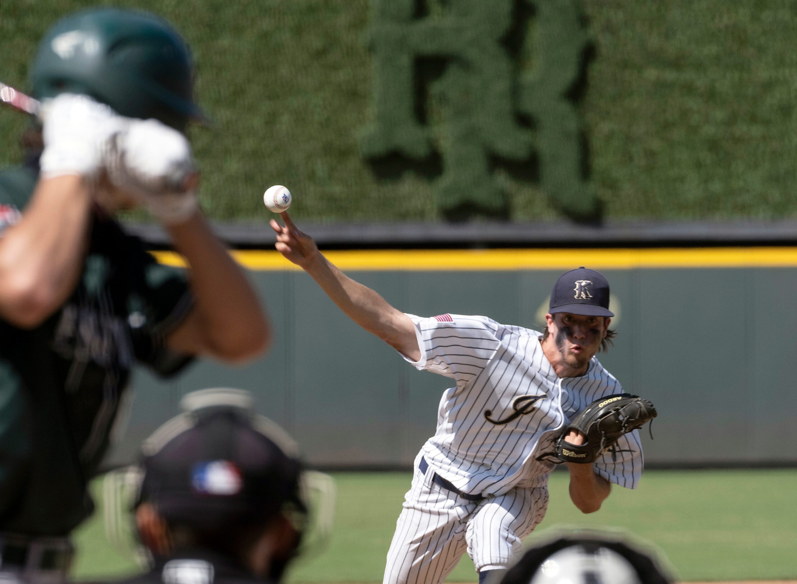 Keller Eric Hammond, (27), pitches against Houston Strake Jesuit Gabe Gruenewald, (8),...