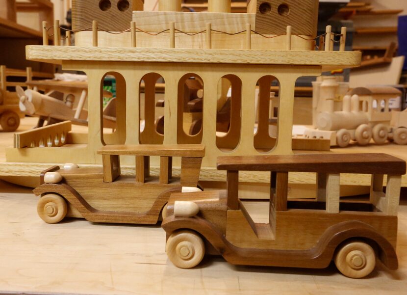 Old fashion toy trucks and ferry are among the toys made woodworker John  Ellzey...