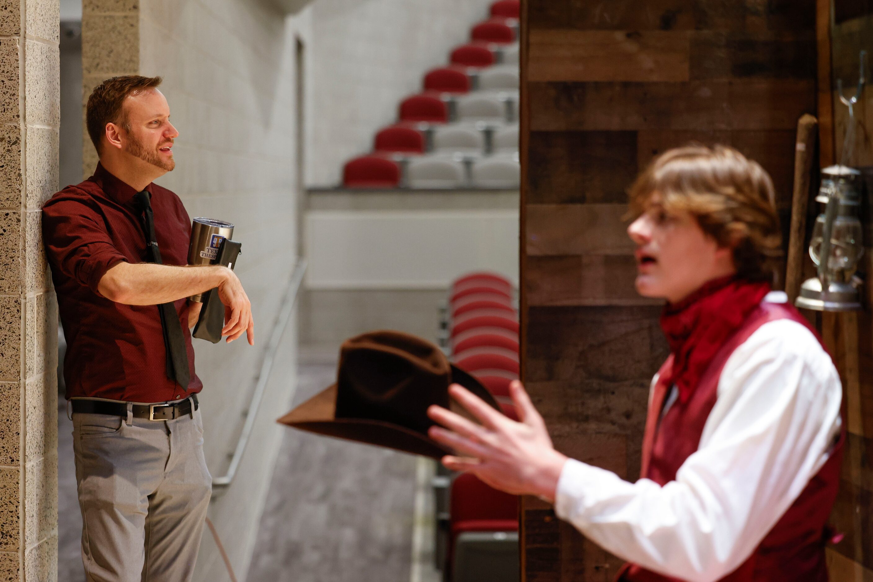 Theatre/artistic director Kyle Nichols (left) observes as cast member Aiden Hill remains on...