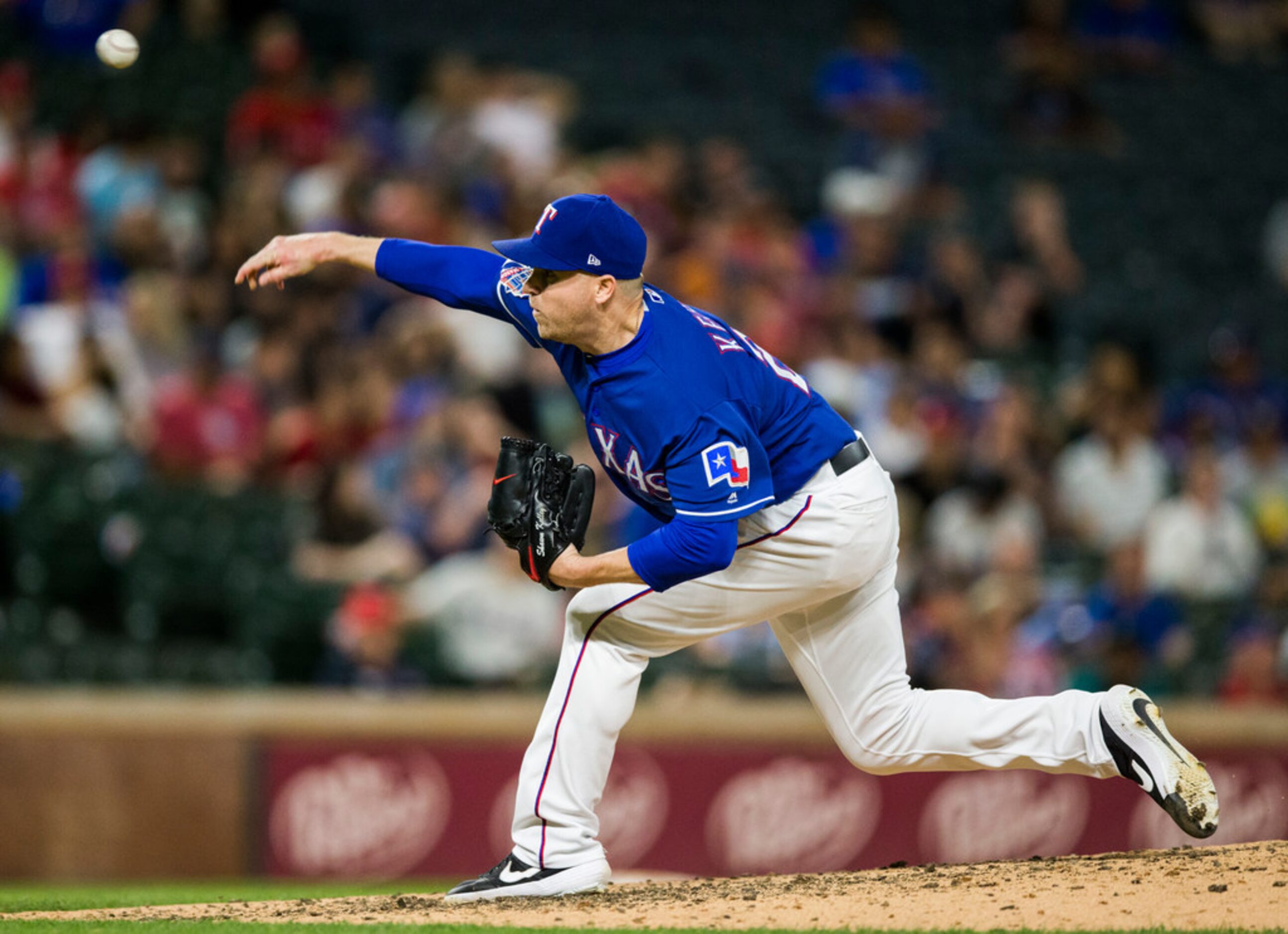 Texas Rangers relief pitcher Shawn Kelley (27) pitches during the ninth inning of an MLB...