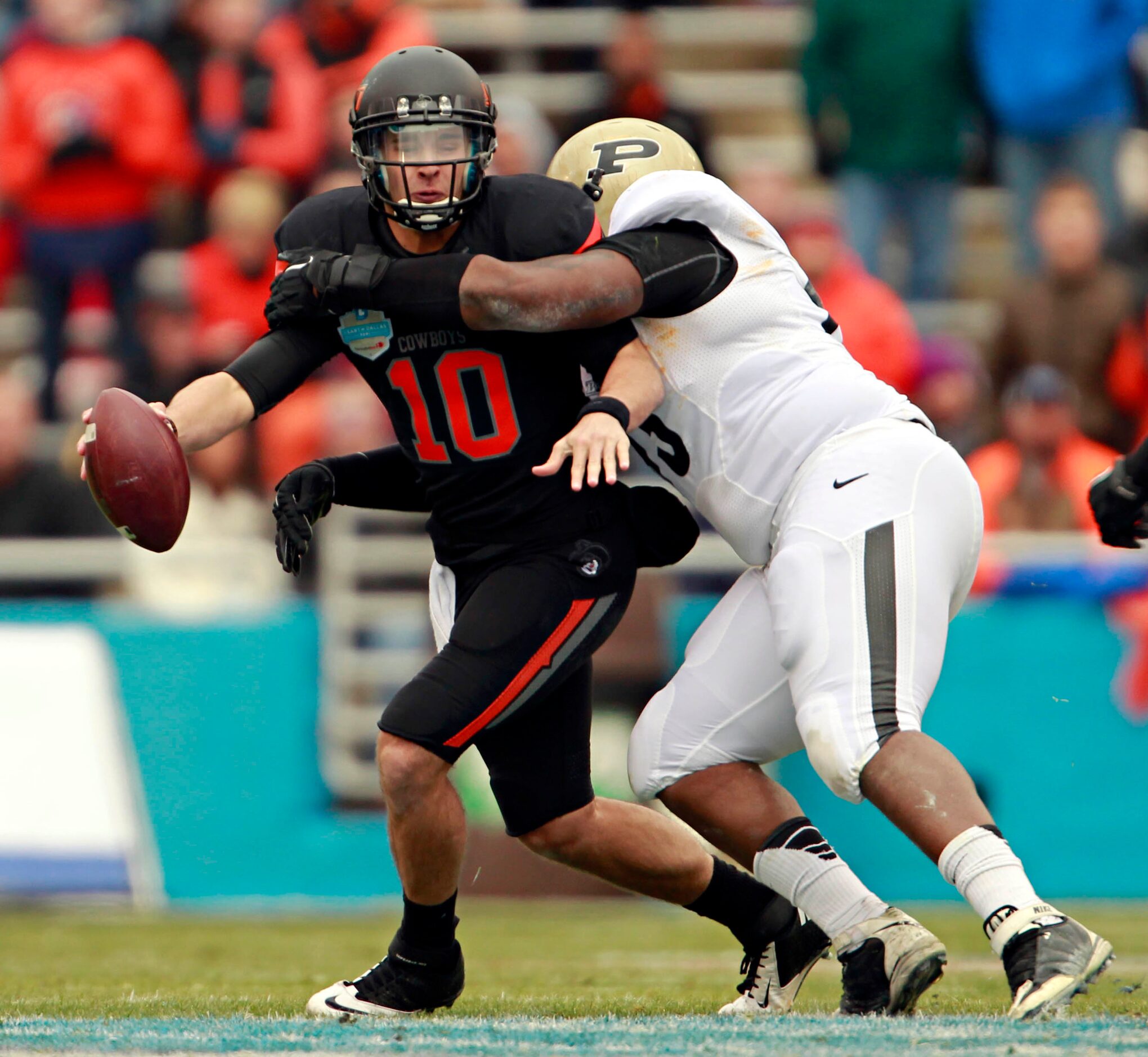 Purdue Boilermakers defensive tackle Kawann Short (93) sacks Oklahoma State Cowboys...