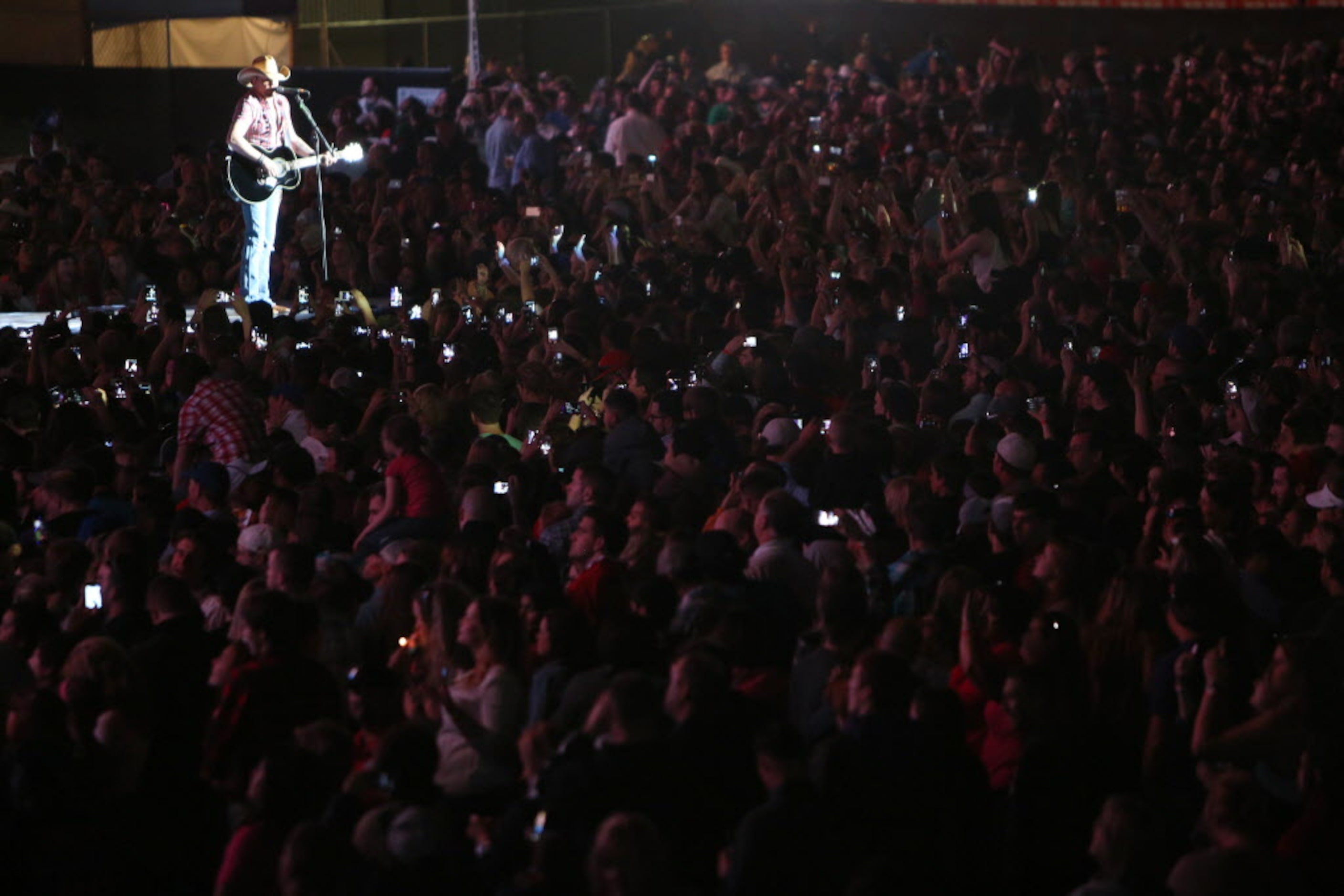 Jason Aldean performs onstage at the 2014 NCAA March Madness Music Festival during the NCAA...