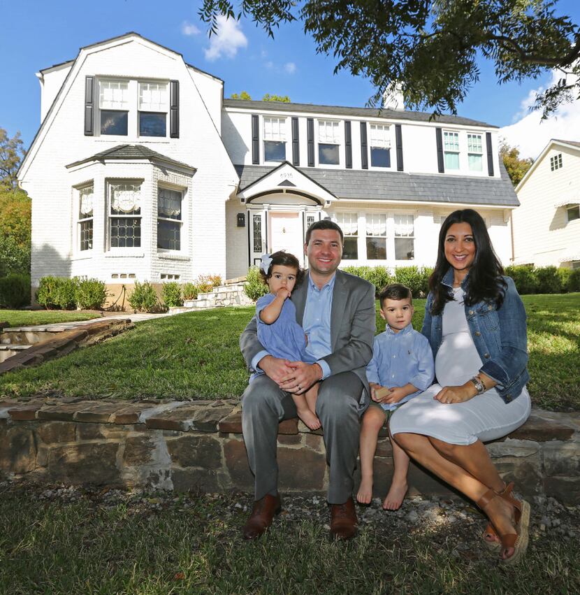 Tony and Ashley Ruggeri pose with their children Juliana and Michael on the front lawn at of...