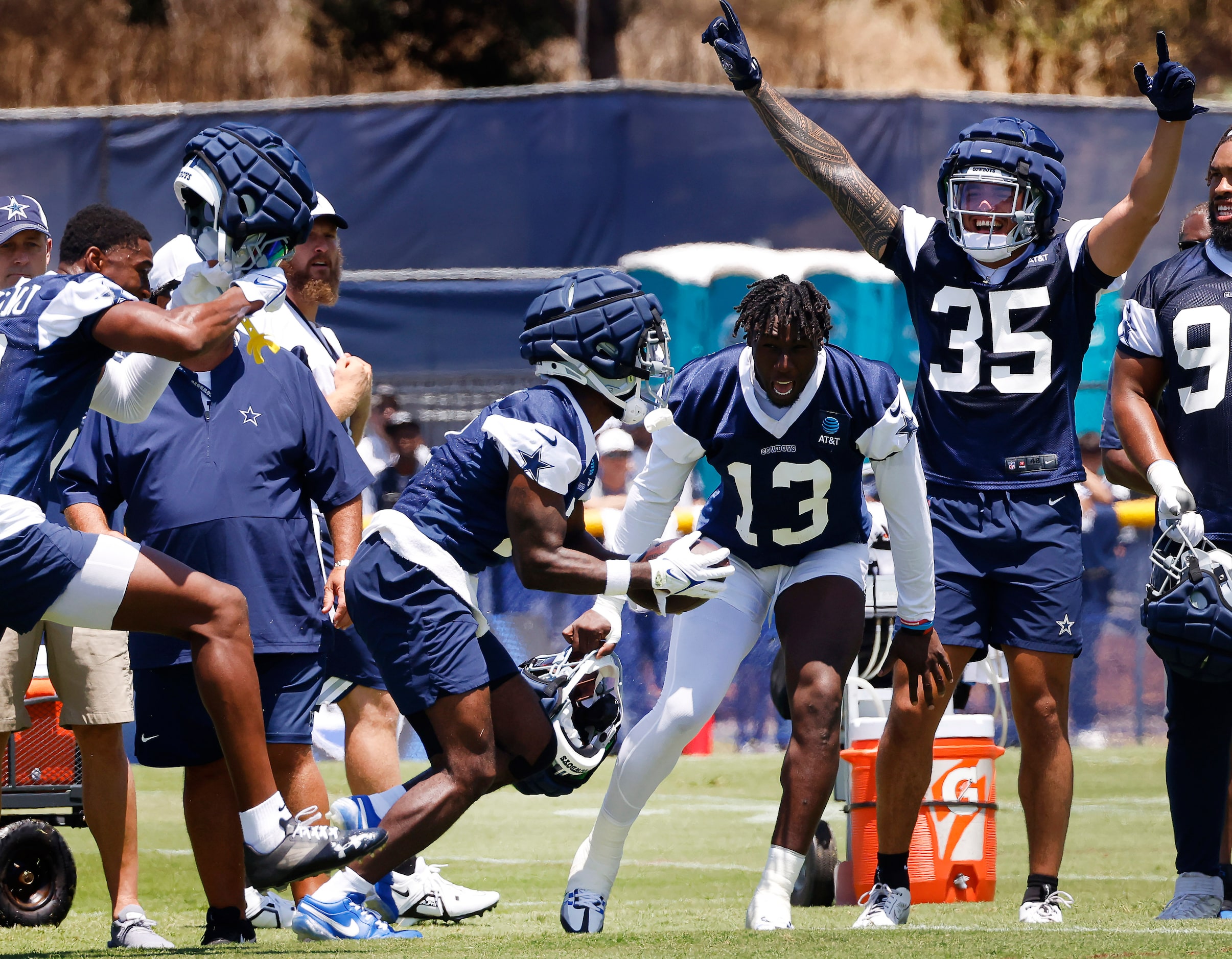 Dallas Cowboys linebacker DeMarvion Overshown (13) and linebacker Marist Liufau (35)...