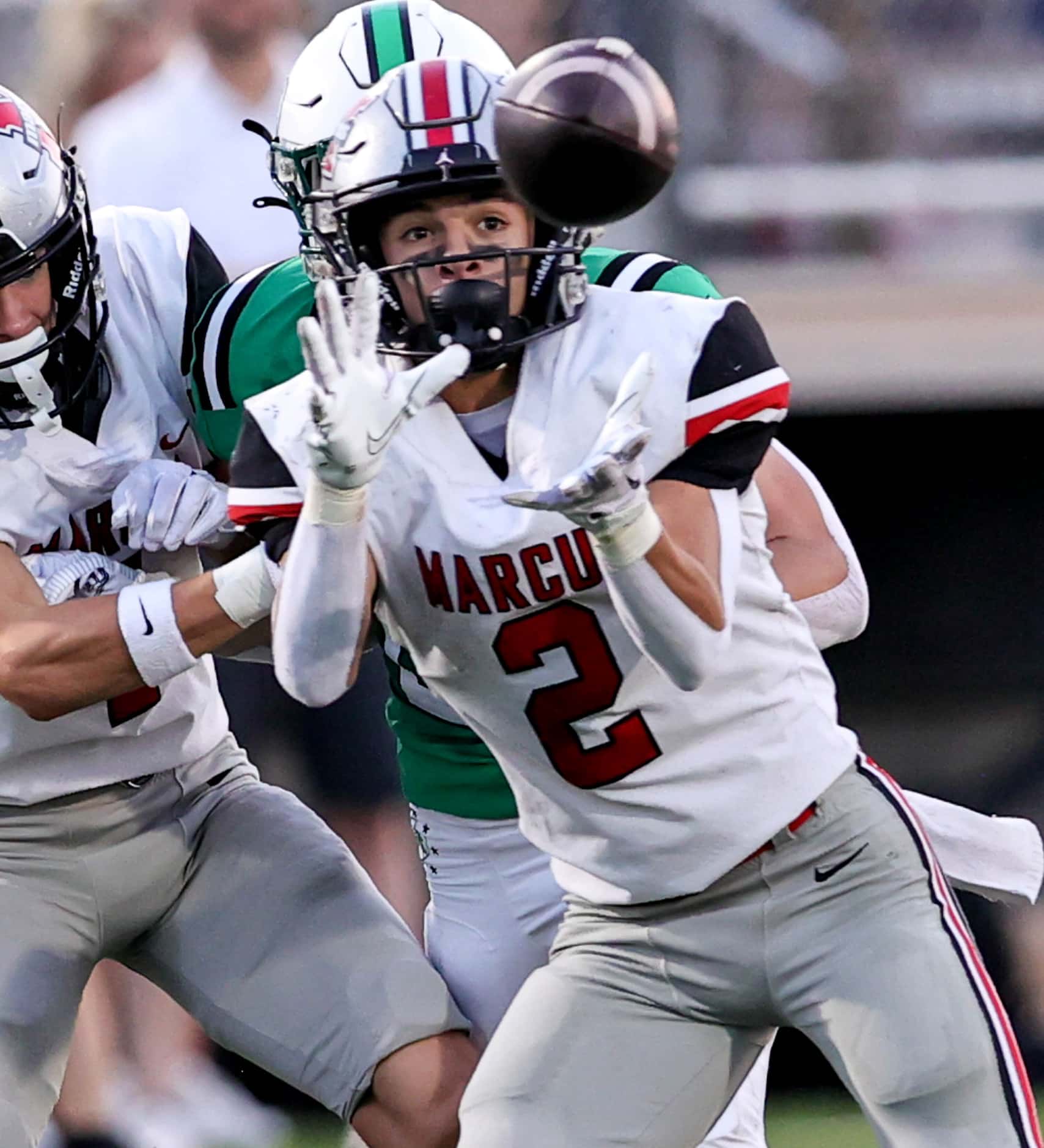 Flower Mound Marcus wide receiver Karic Grennan comes up with a reception and goes the...