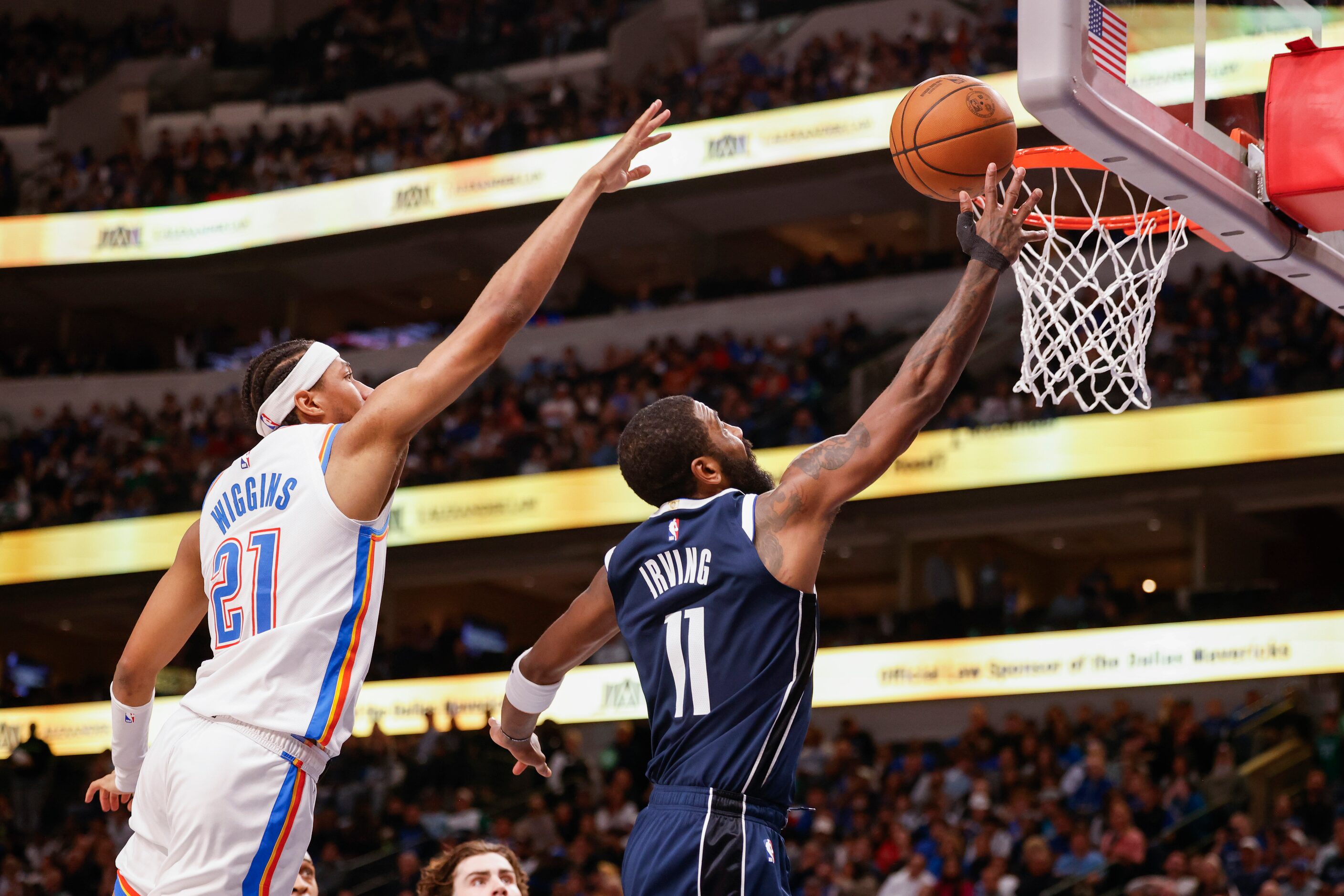 Oklahoma City Thunder guard Aaron Wiggins (21) fails to block a layup by Dallas Mavericks...