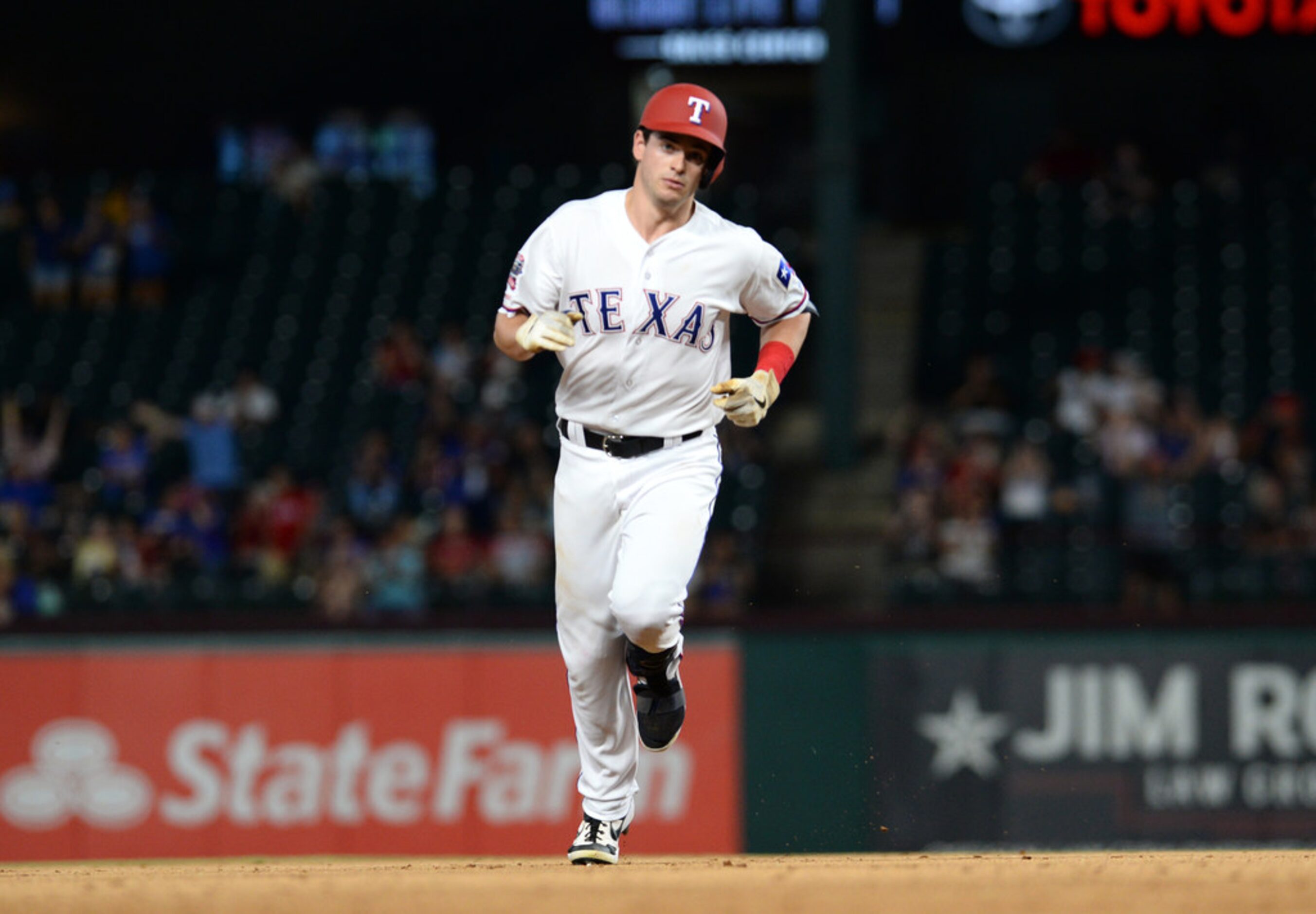 ARLINGTON, TEXAS - AUGUST 20: Nick Solak #15 of the Texas Rangers rounds the bases after a...