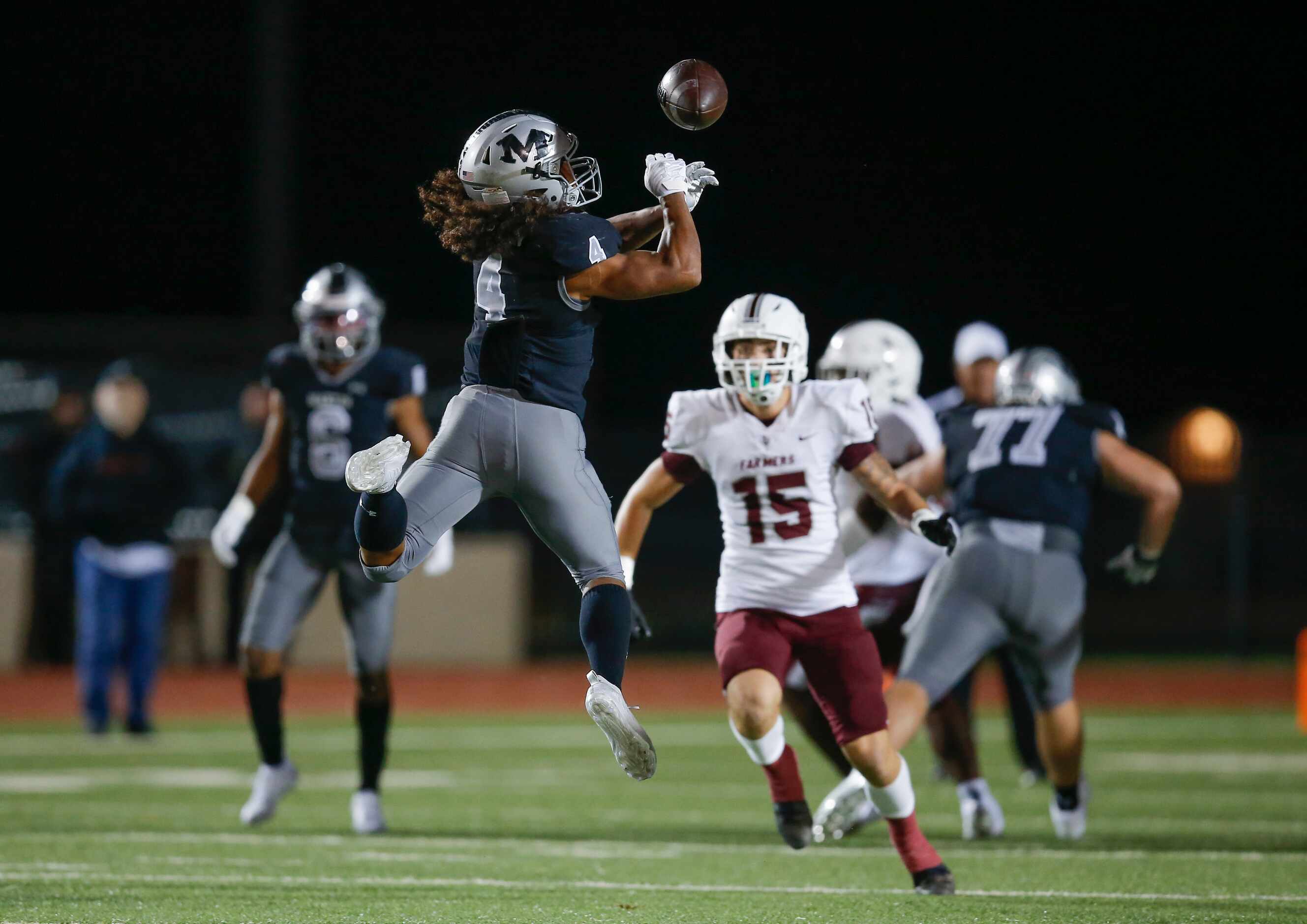 Arlington Martin junior Zaire Barrow (4) is unable to catch a pass during the first half of...