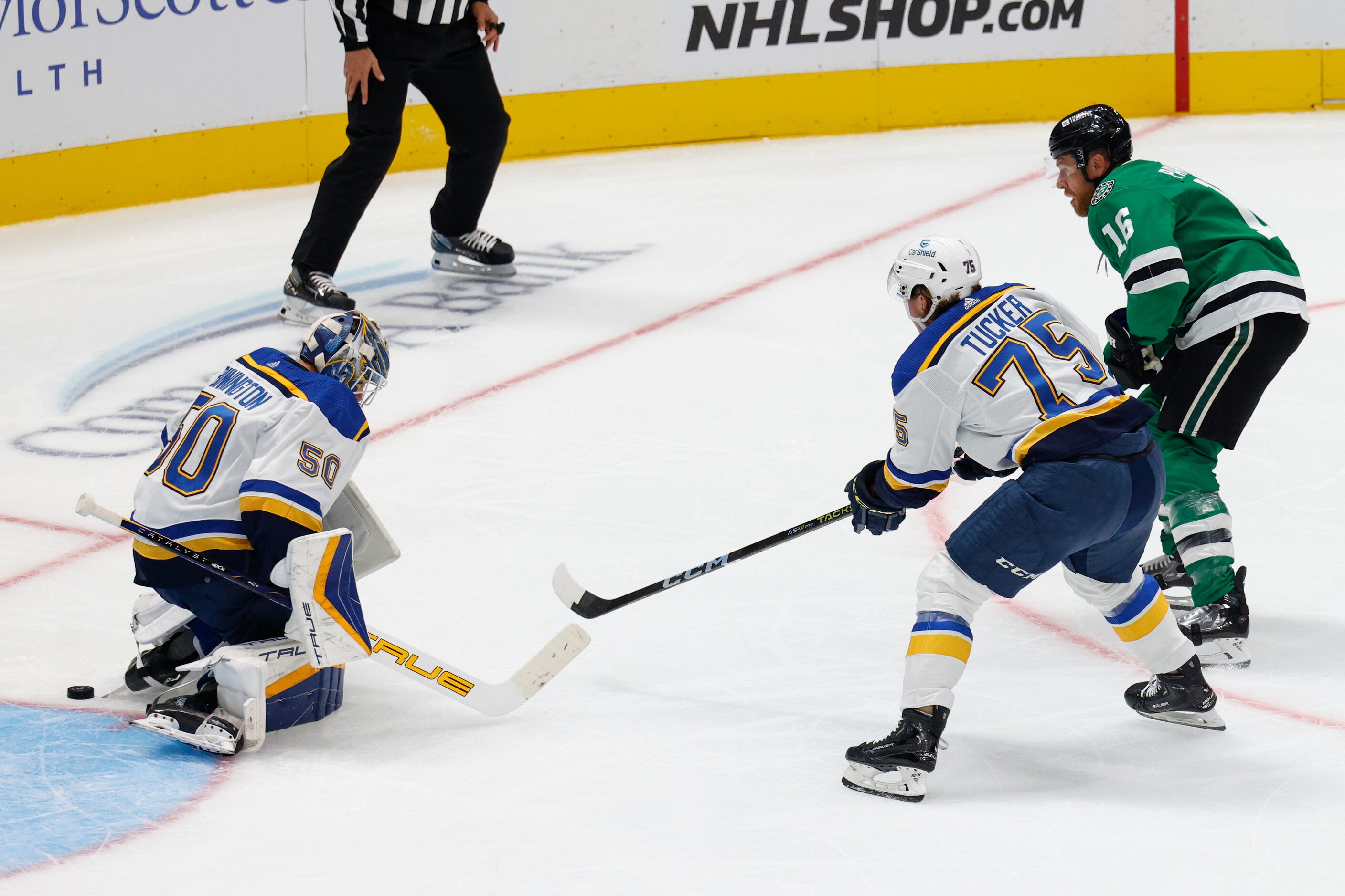 Dallas Stars center Joe Pavelski (16) fires a shot alongside St. Louis Blues defenseman...