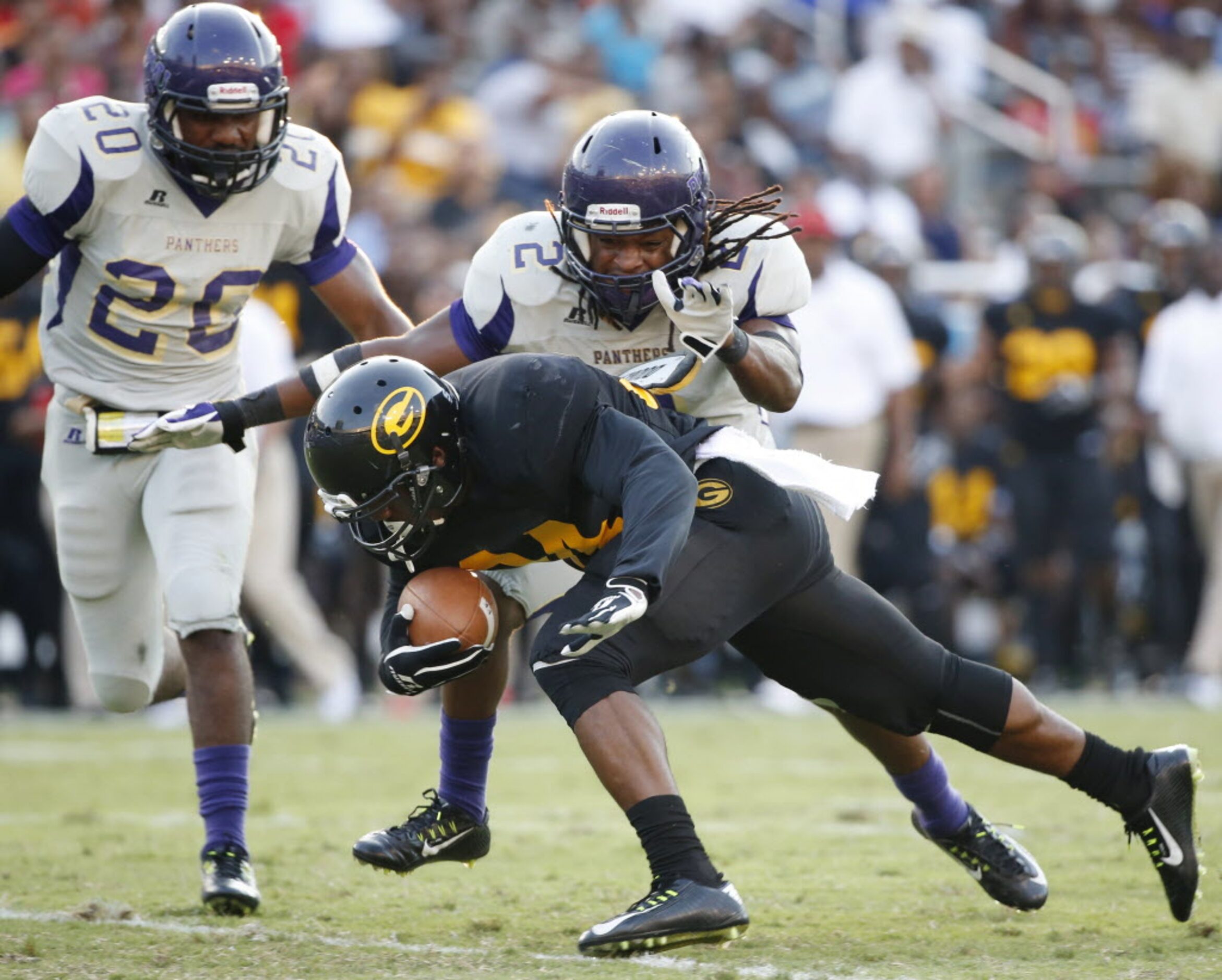 Prairie View A&M safety Damond Jackson (2) attempts to tackle Grambling State running back...