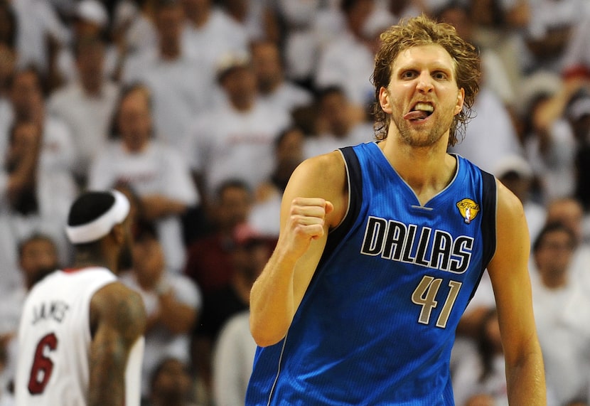 Dirk Nowitzki of the Dallas Mavericks celebrates a point against the Miami Heat in Game 6 of...