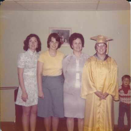 Barbara Fay Villarreal (far right) poses for a photograph on her high school graduation day...