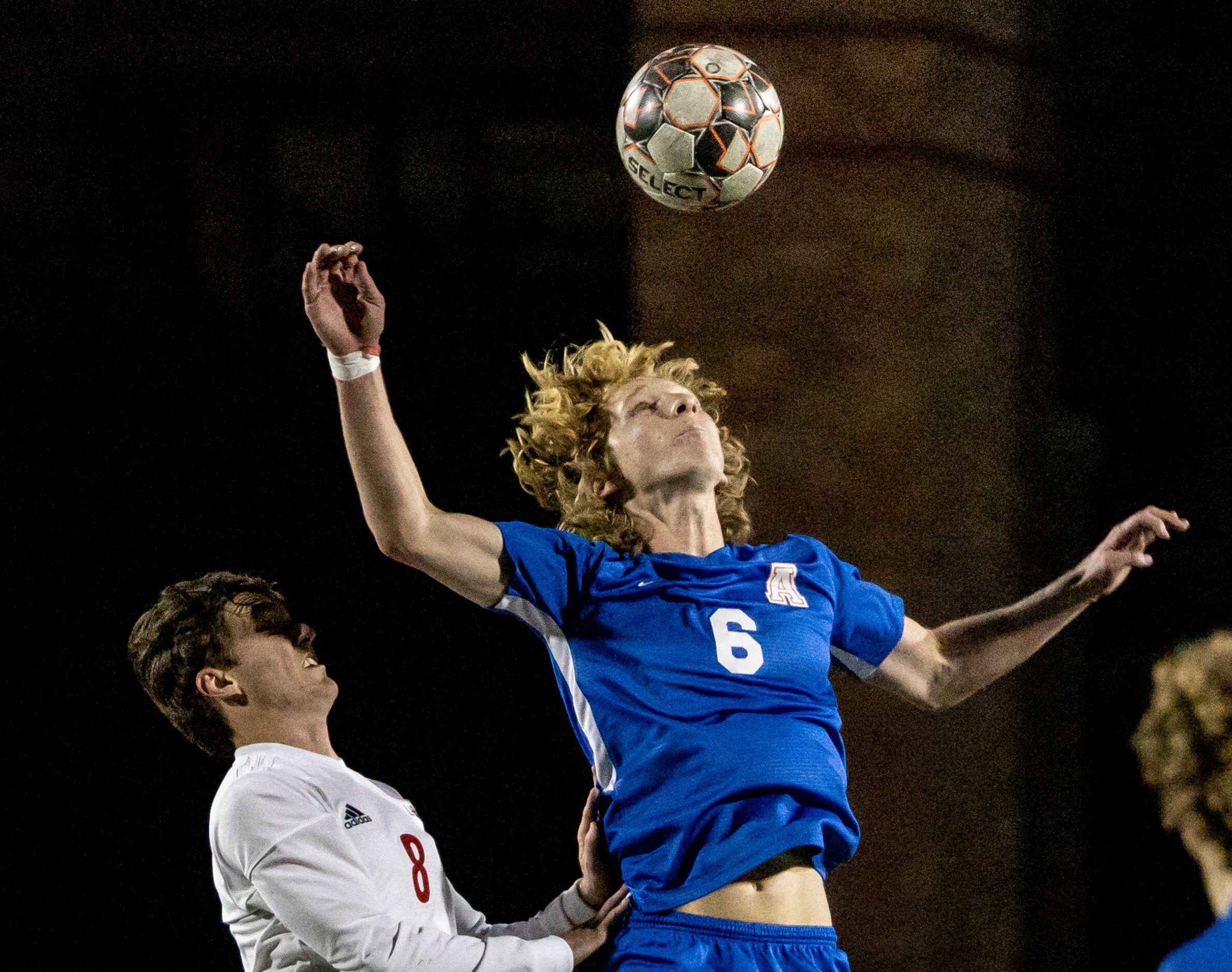 Lake Highlands High School Jake Bernhard pushes against Allen High School Evan Pustejovsky...