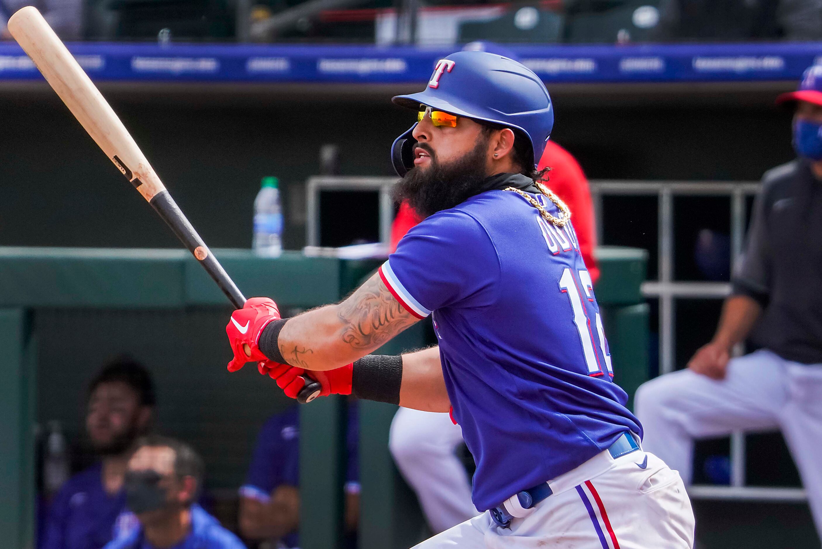 Texas Rangers infielder Rougned Odor watches the flight of his 2-run home run off of Los...