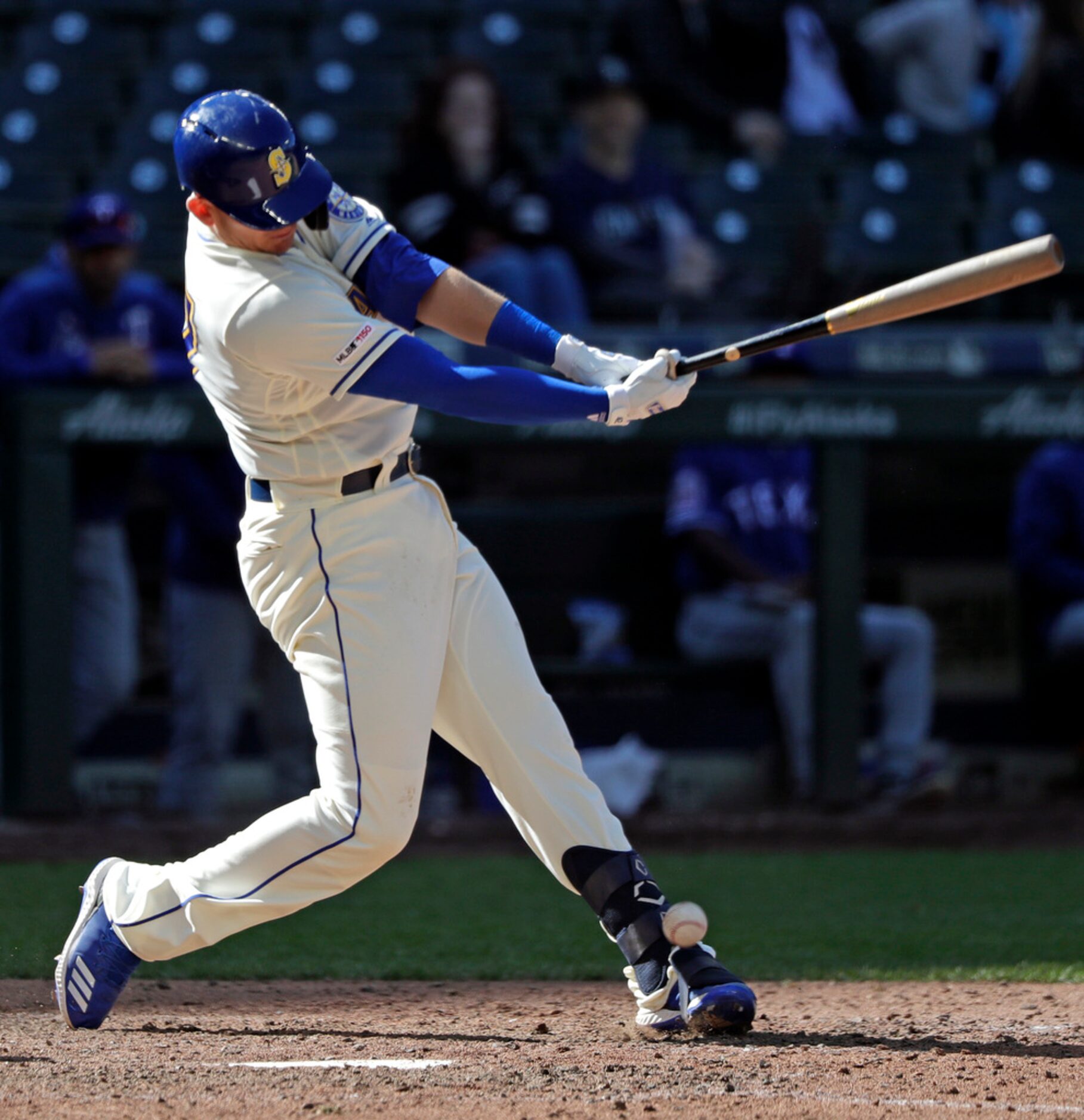 Seattle Mariners' Ryon Healy hits a foul ball off his ankle in the ninth inning of a...