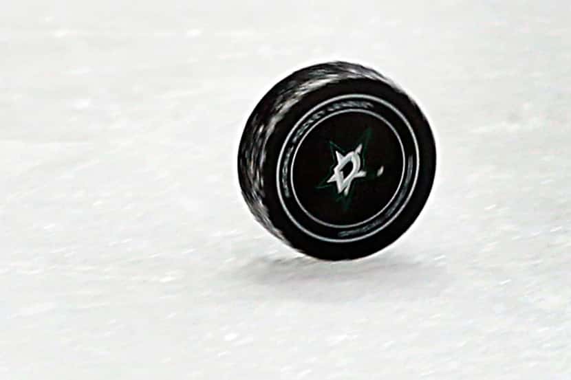 The puck rolls the length of the ice after an officials whistle during the Dallas...