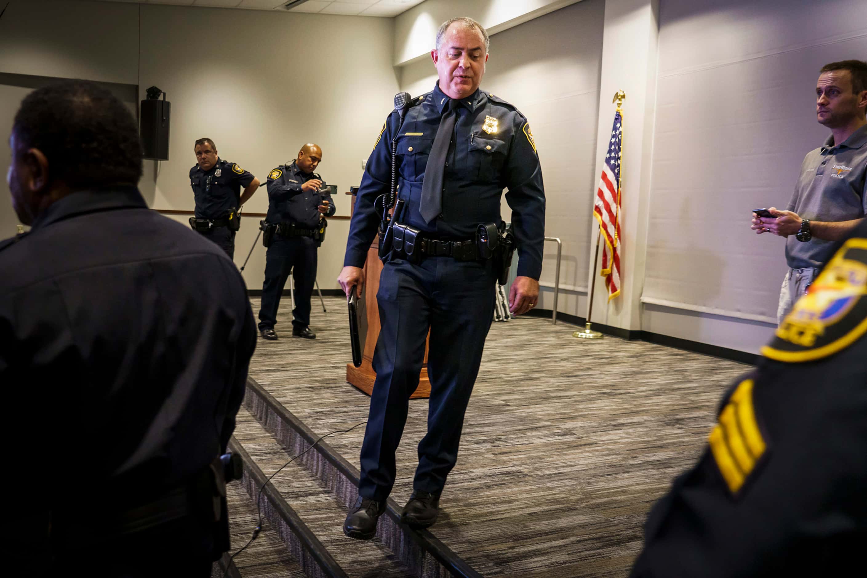 Fort Worth police Lt. Brandon OÕNeil departs after addressing a news conference regarding...