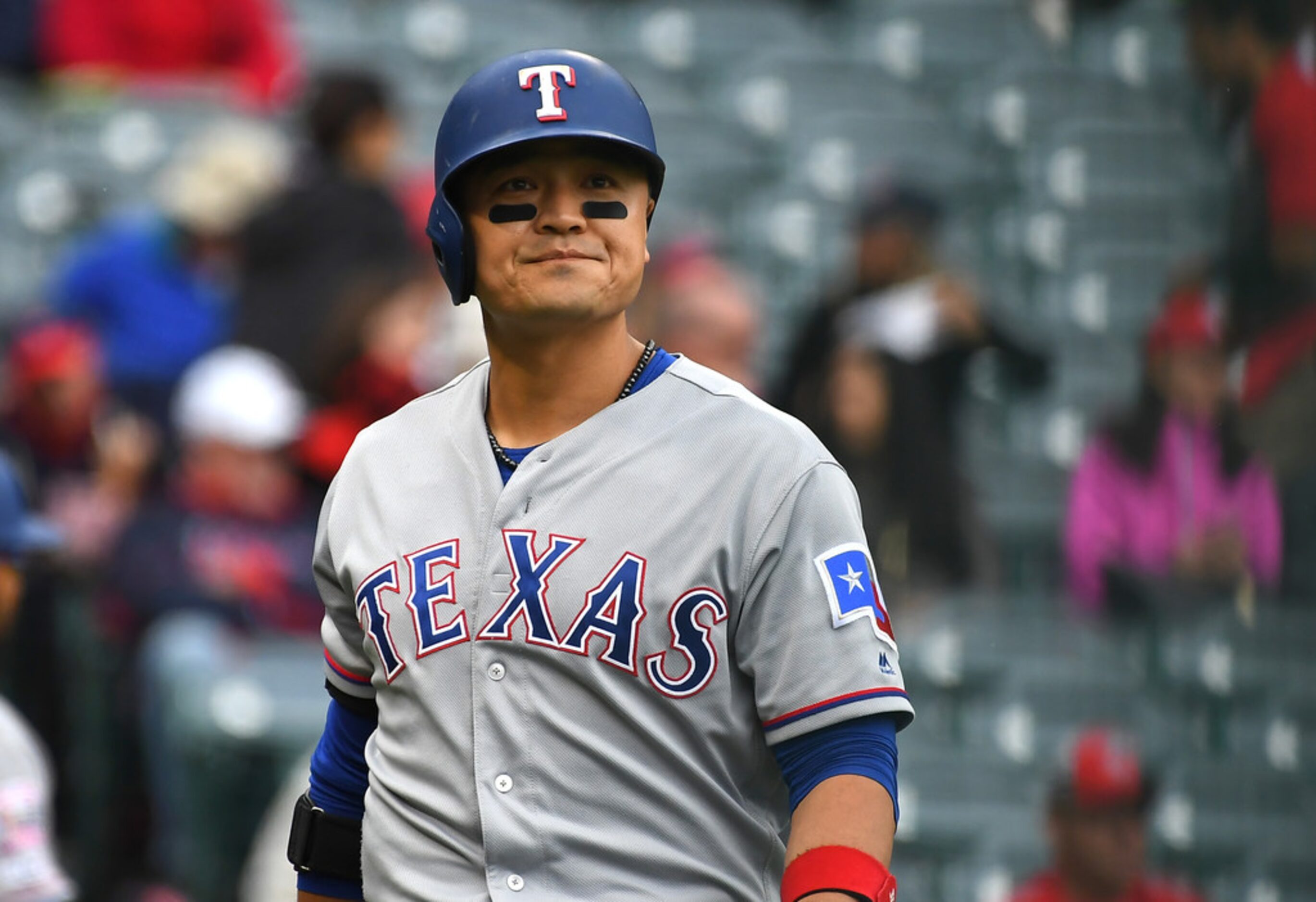 ANAHEIM, CA - MAY 26: Shin-Soo Choo #17 of the Texas Rangers returns to the dugout after...