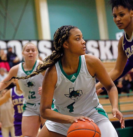 Southlake Carroll's Natalia Jordan (4) looks to pass against Keller Timber Creek's Jillian...