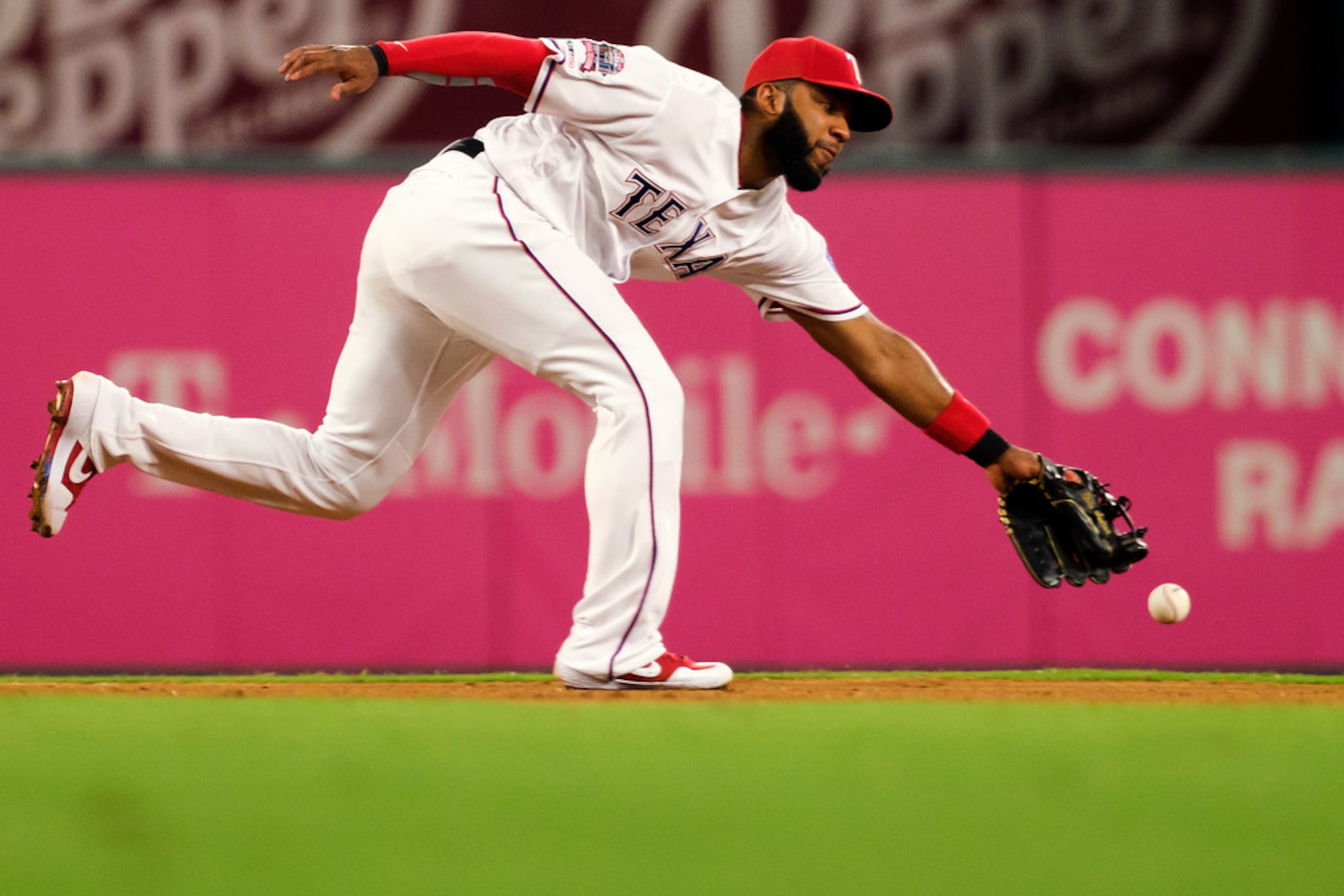 Texas Rangers shortstop Elvis Andrus (1) canÃt make the play on a single off the bat of...