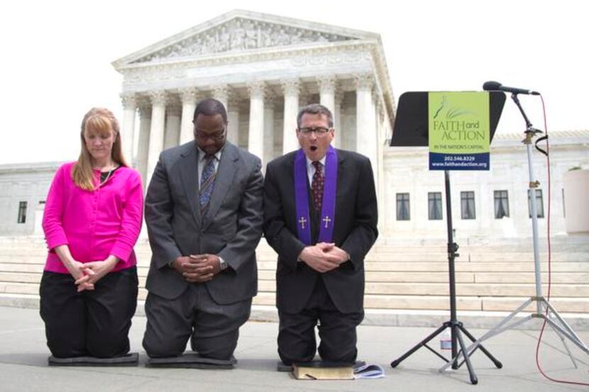 
The Rev. Rob Schenck, of Faith and Action, right, prays in front of the Supreme Court with...