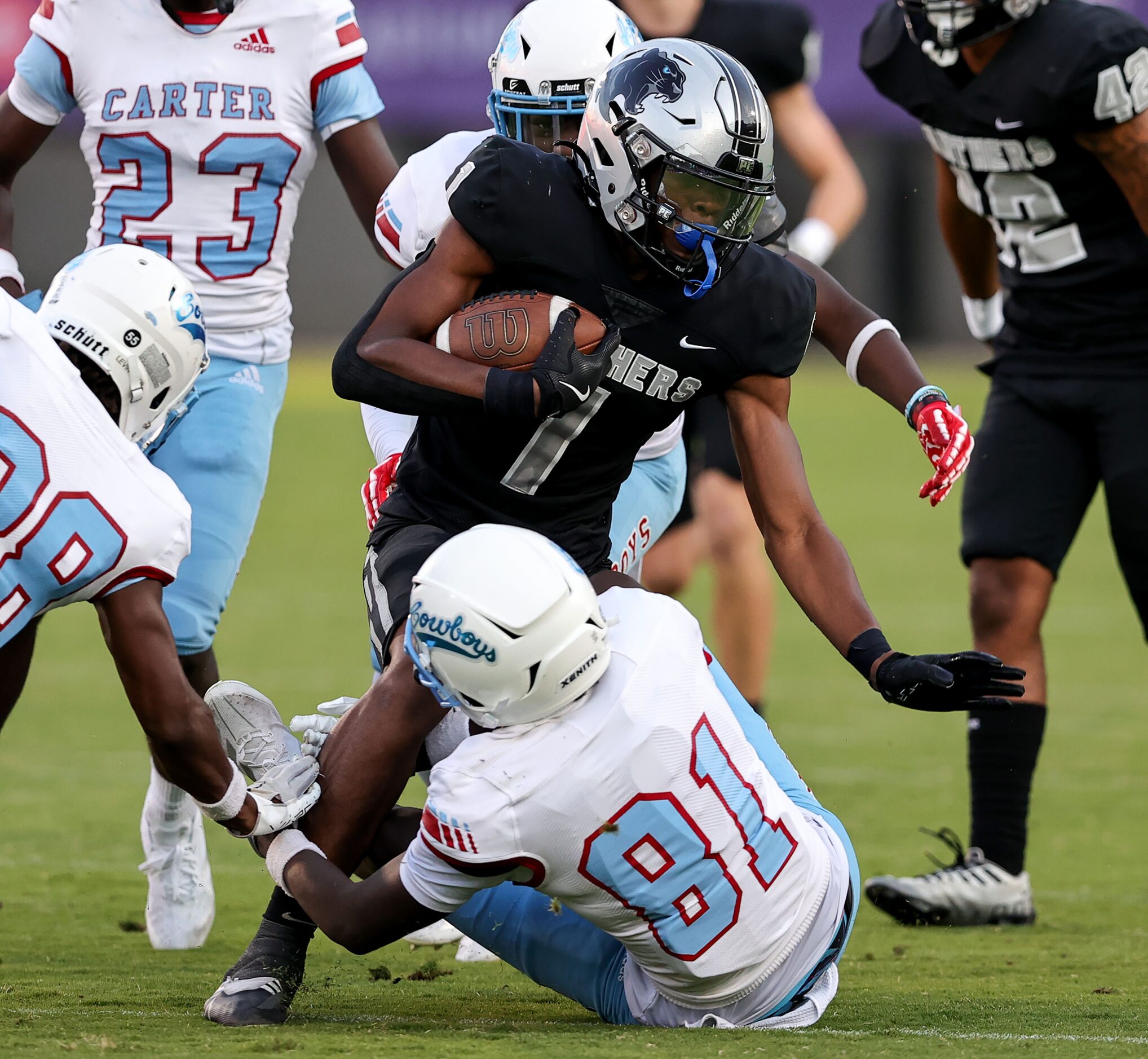 Frisco Panther Creek kick returner Sentel Simpson (1) returns a kickoff and is brought down...