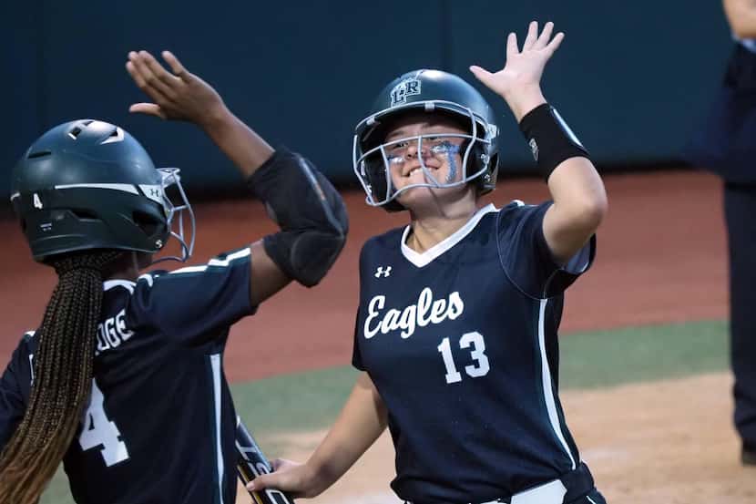 Mansfield Lake Ridge batters Jordan Householder (right) and Kassidy Chance(left) react after...