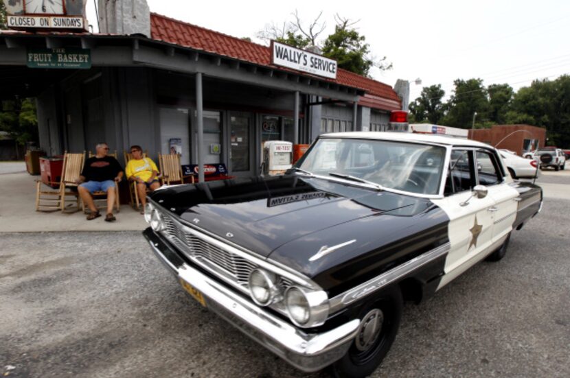 Mike and Terry Jones sit outside Wally's Service, a replica of the Andy Griffith Show, in...