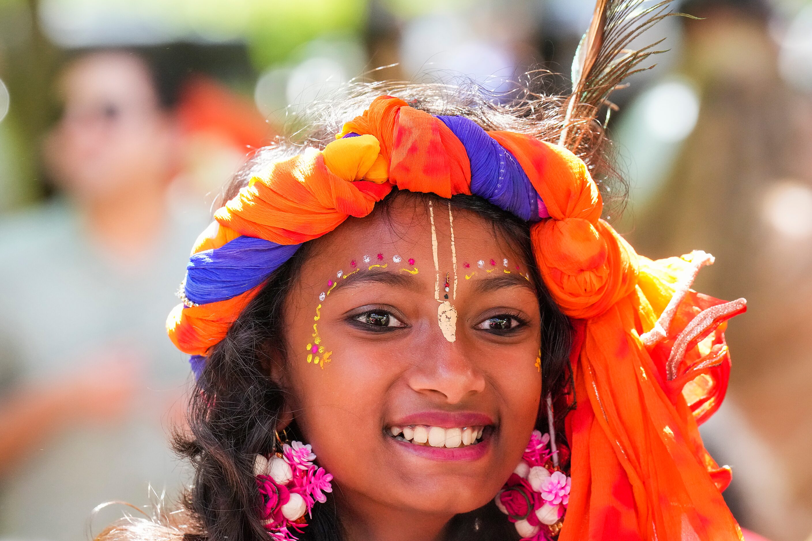 Sahana Vinod, 10, Keller watches festivities during the Festival of Joy on Saturday, April...