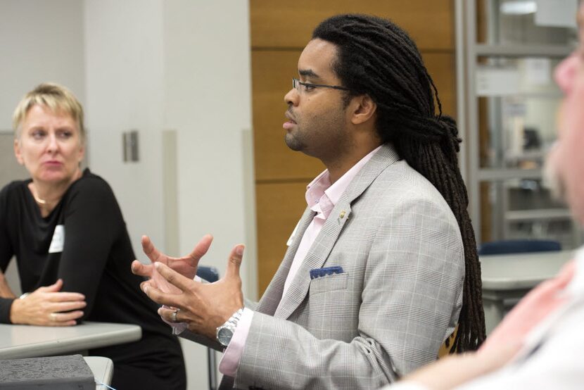 Darius Frasure, a professor at Mountain View College, participates in a small group session...