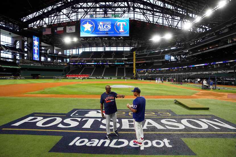 Texas Rangers third base coach Tony Beasley (right) talks with prior to Houston Astros third...