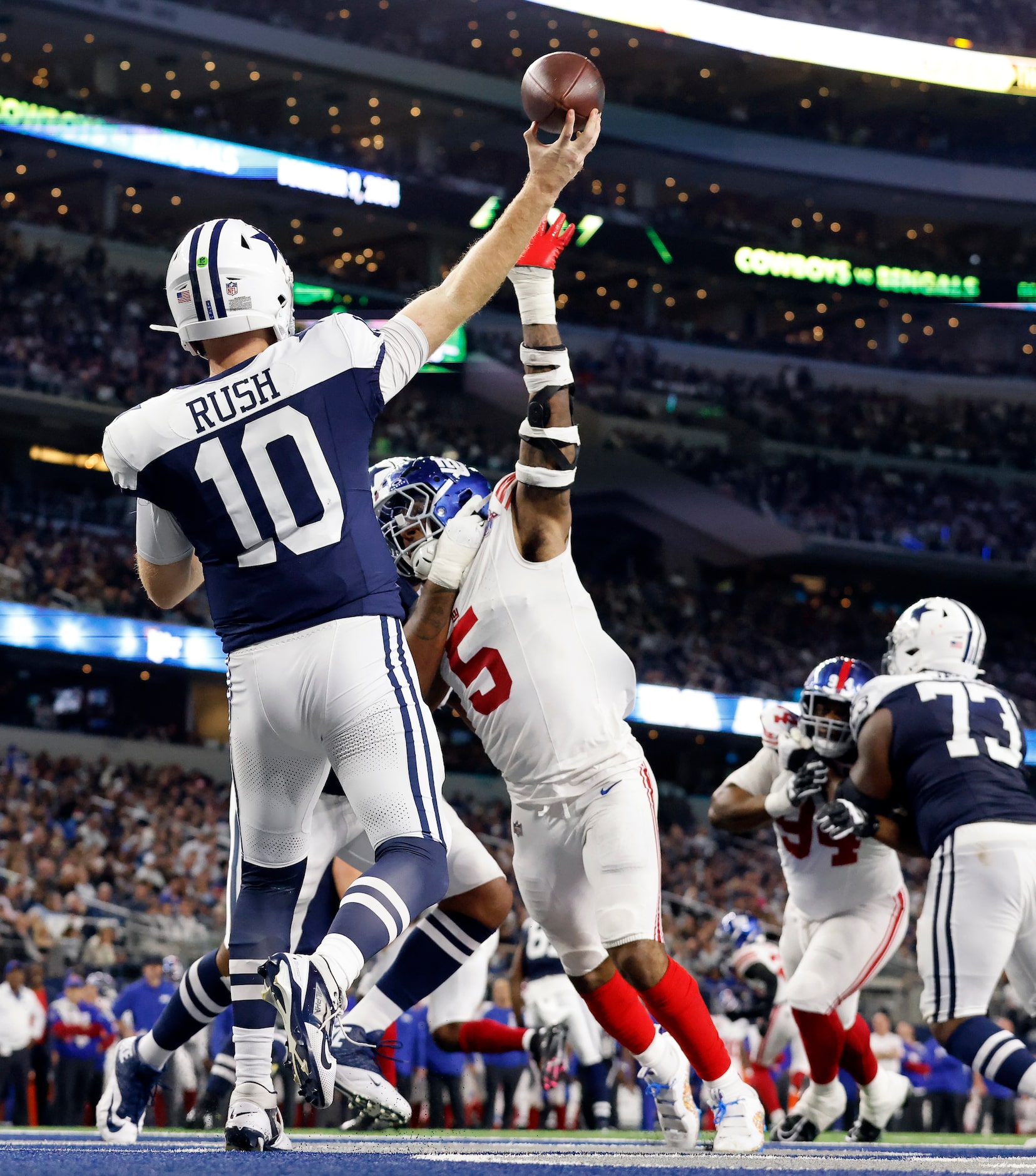 Dallas Cowboys quarterback Cooper Rush (10) throws a deep pass from the end zone as New York...