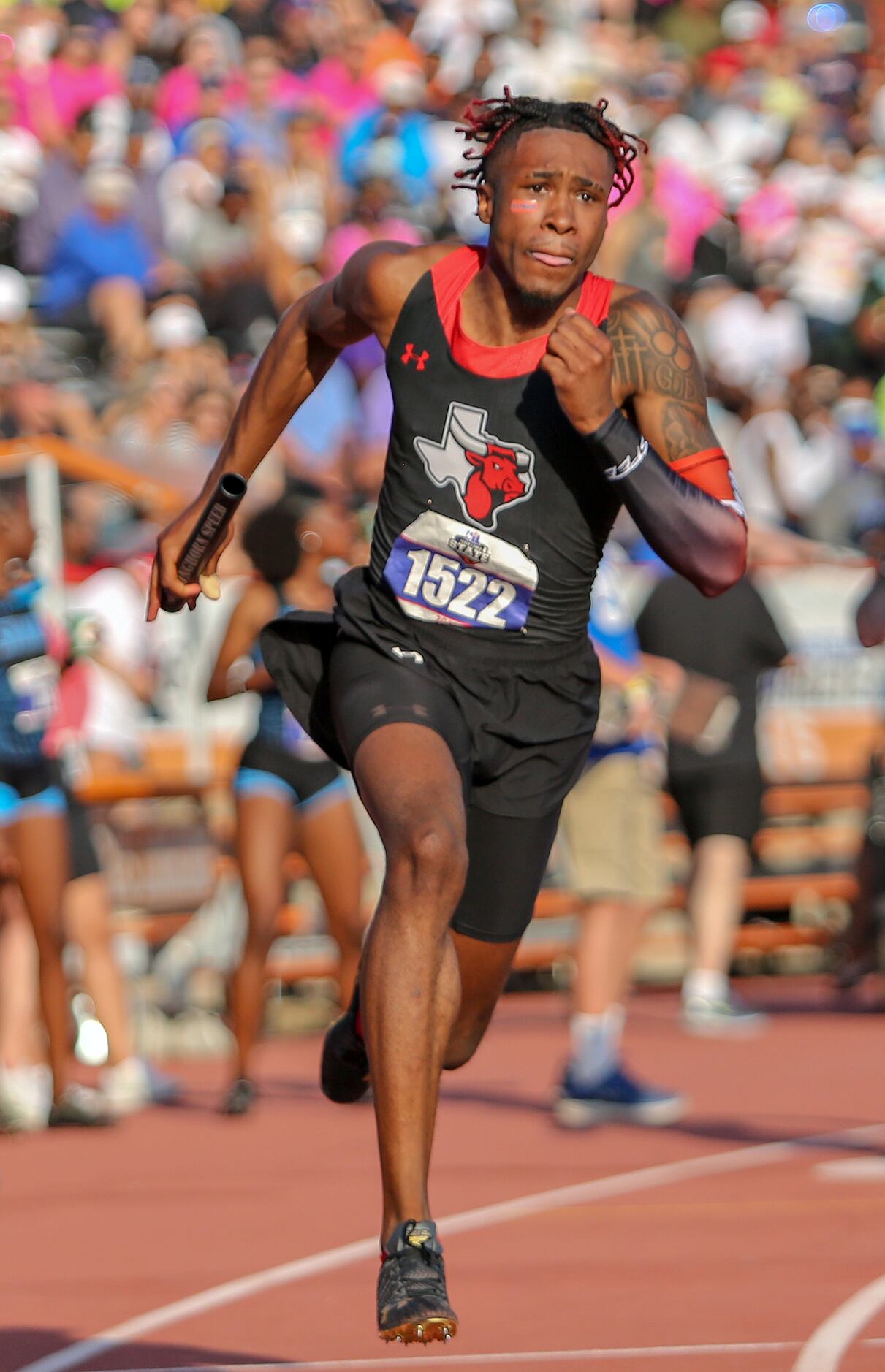 Dacorey Ware of Cedar Hill competes in the 6A Boys 4x200 meter relay during the UIL state...