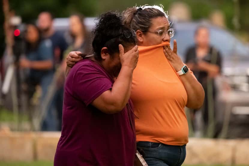 Women react after leaving the SSGT Willie de Leon Civic Center where families were reunited...