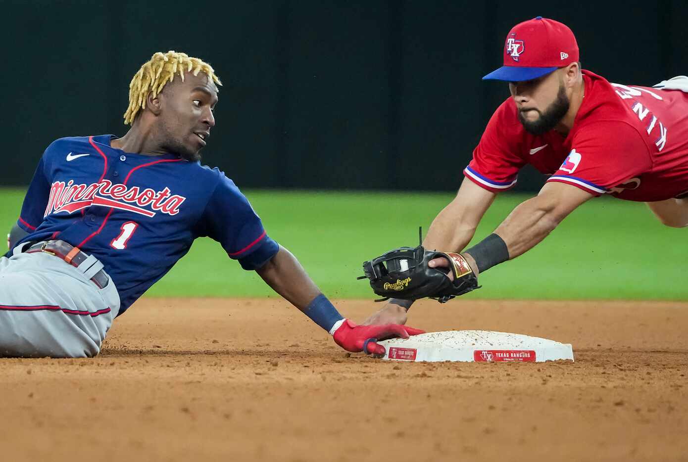 Minnesota Twins center fielder Nick Gordon is safe at second base with a double ahead of the...