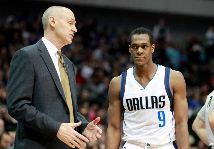 Dallas Mavericks head coach Rick Carlisle (L) talks to guard Rajon Rondo (9) against the...