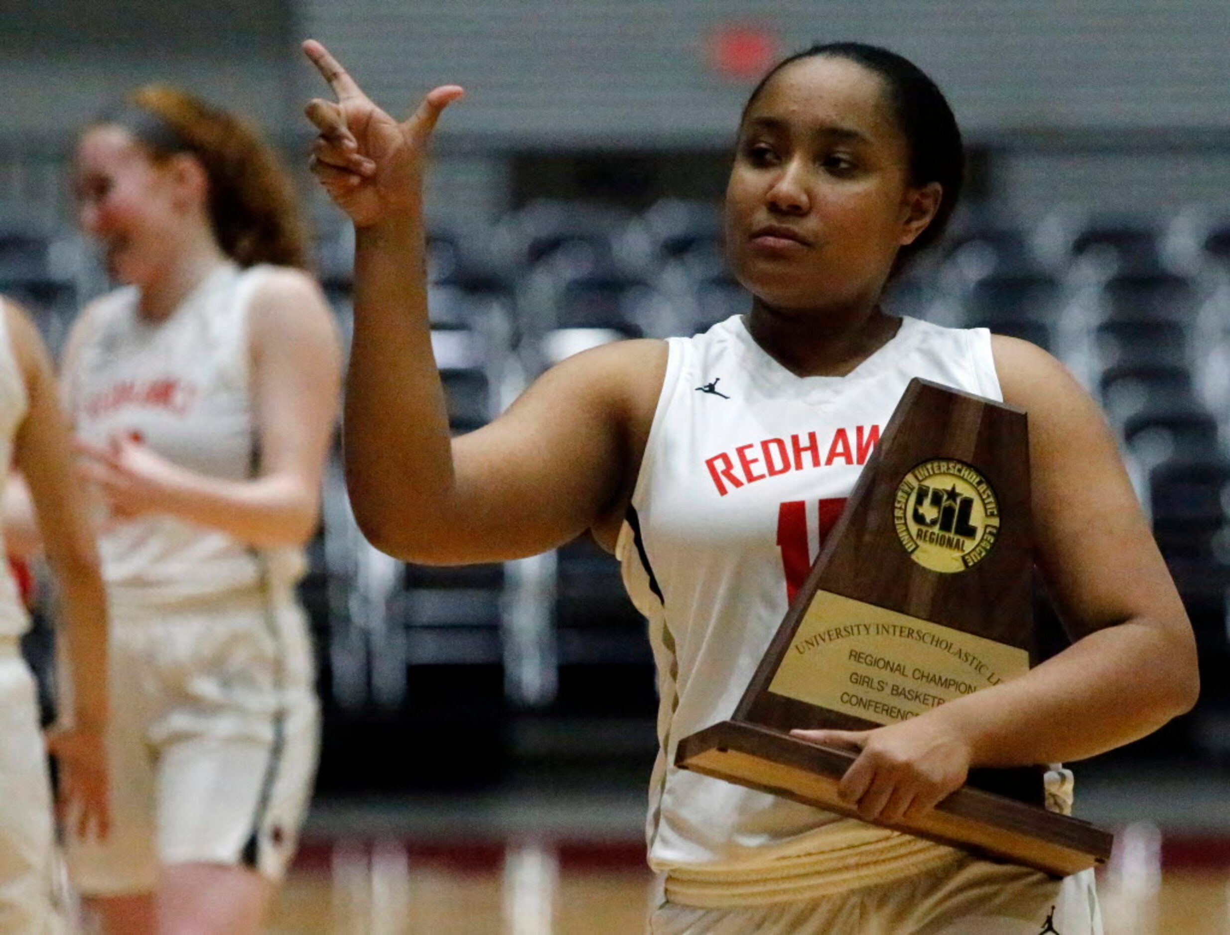 Liberty High School forward Brittany O'Reilly-Ward (15) walks off the floor with the...