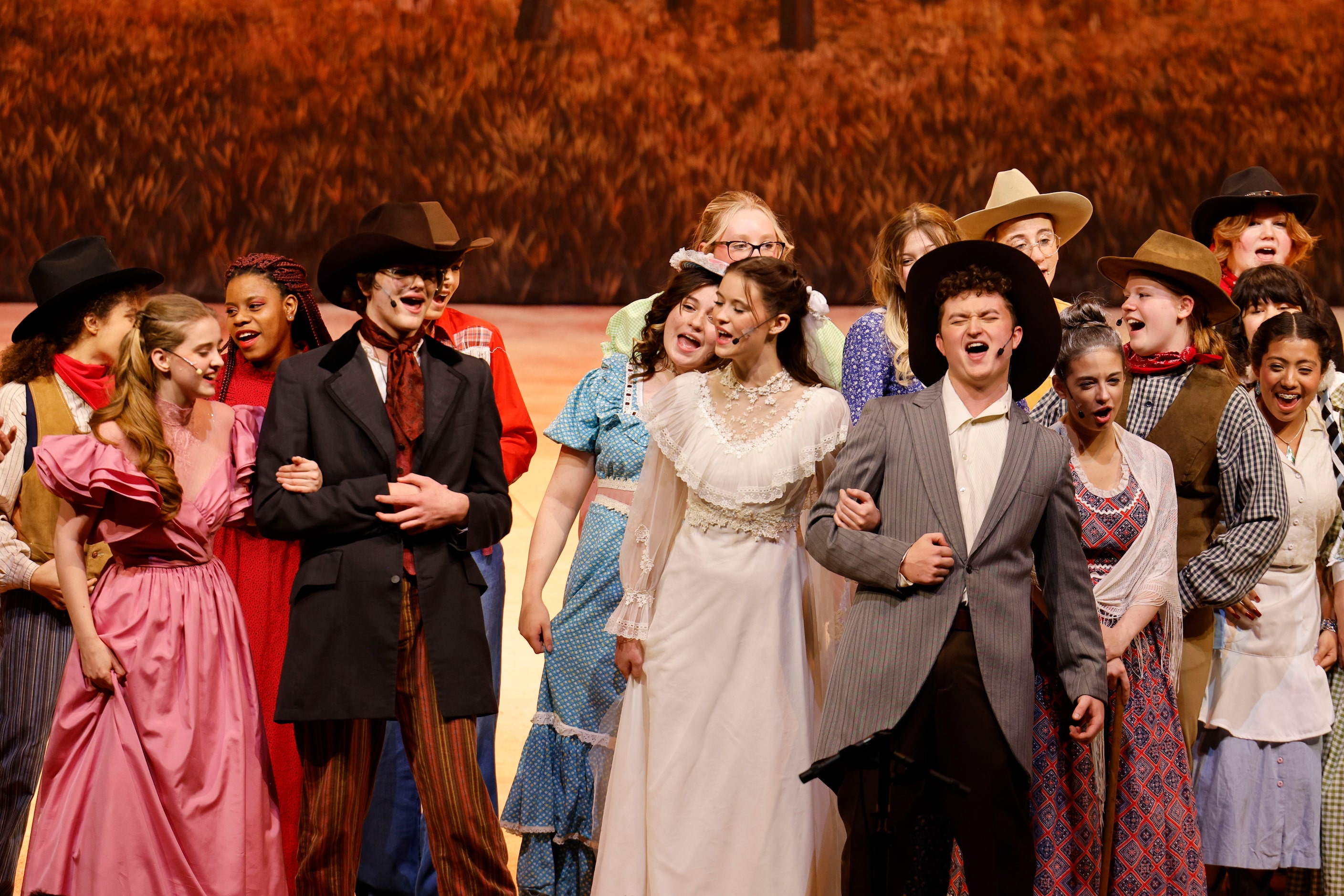 From front left, Avery Tollison as Ado Annie,  Aiden Hill as Will Parker, Grey Dutton as...