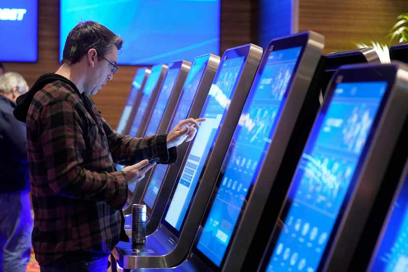 Shawn Harnish, from Boston, placed a sports bet at a kiosk at Encore Boston Harbor casino on...