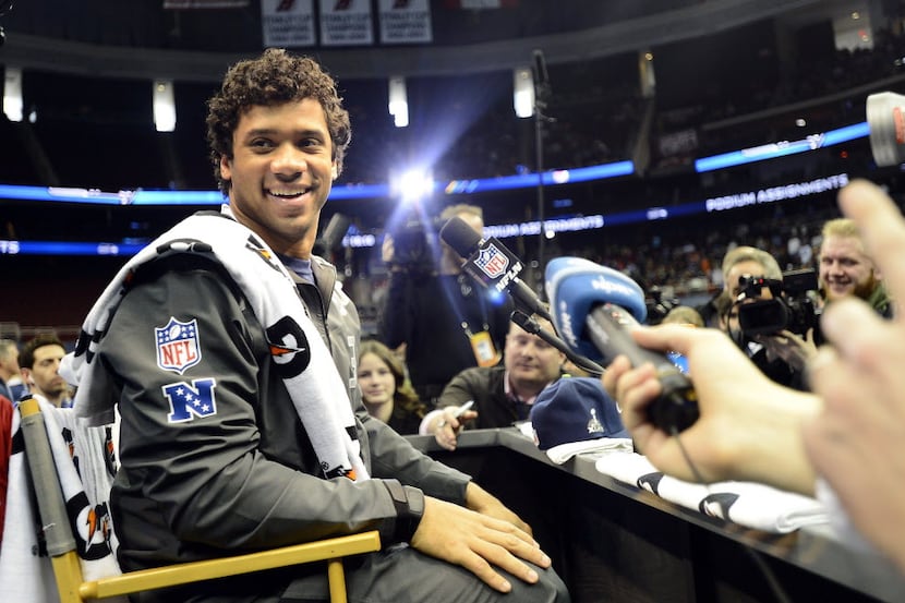 Seattle Seahawks' Russell Wilson speaks to the media during NFL Media Day at the Prudential...