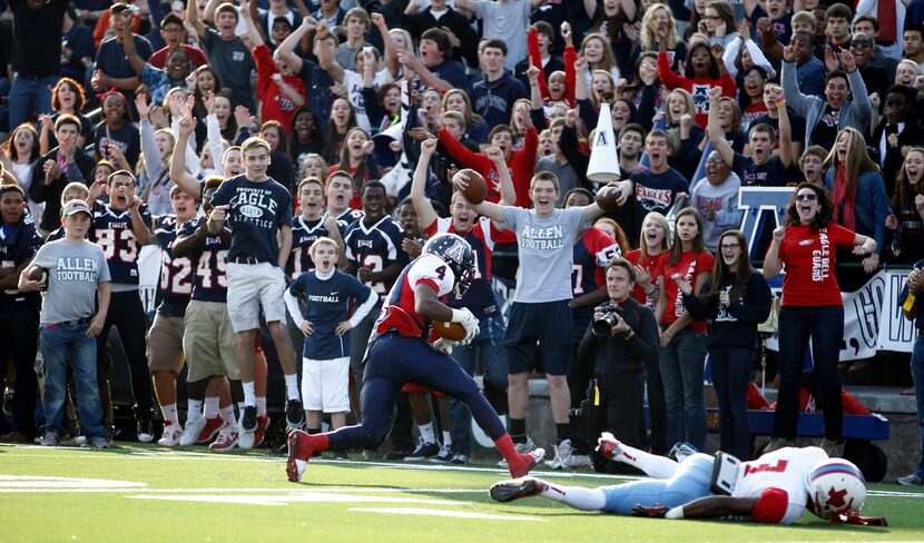 Allen's sideline celebrates after Allen's Mayomi Olootu (4) intercepts a pass intended for...