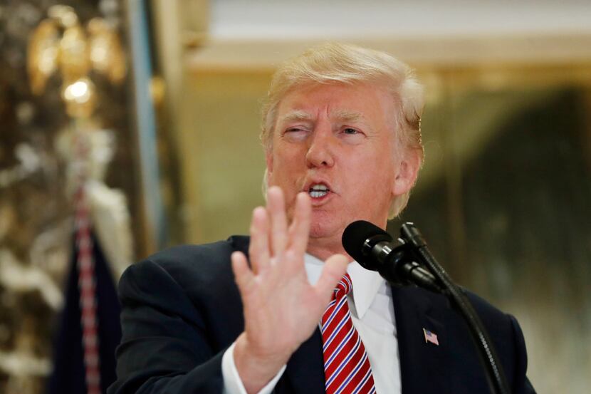 President Donald Trump speaks to the media in the lobby of Trump Tower in New York on Aug....