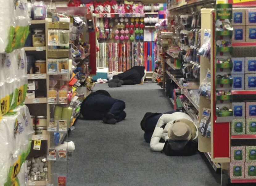 Stranded motorists rested in the aisles at a CVS pharmacy in Atlanta on Wednesday.