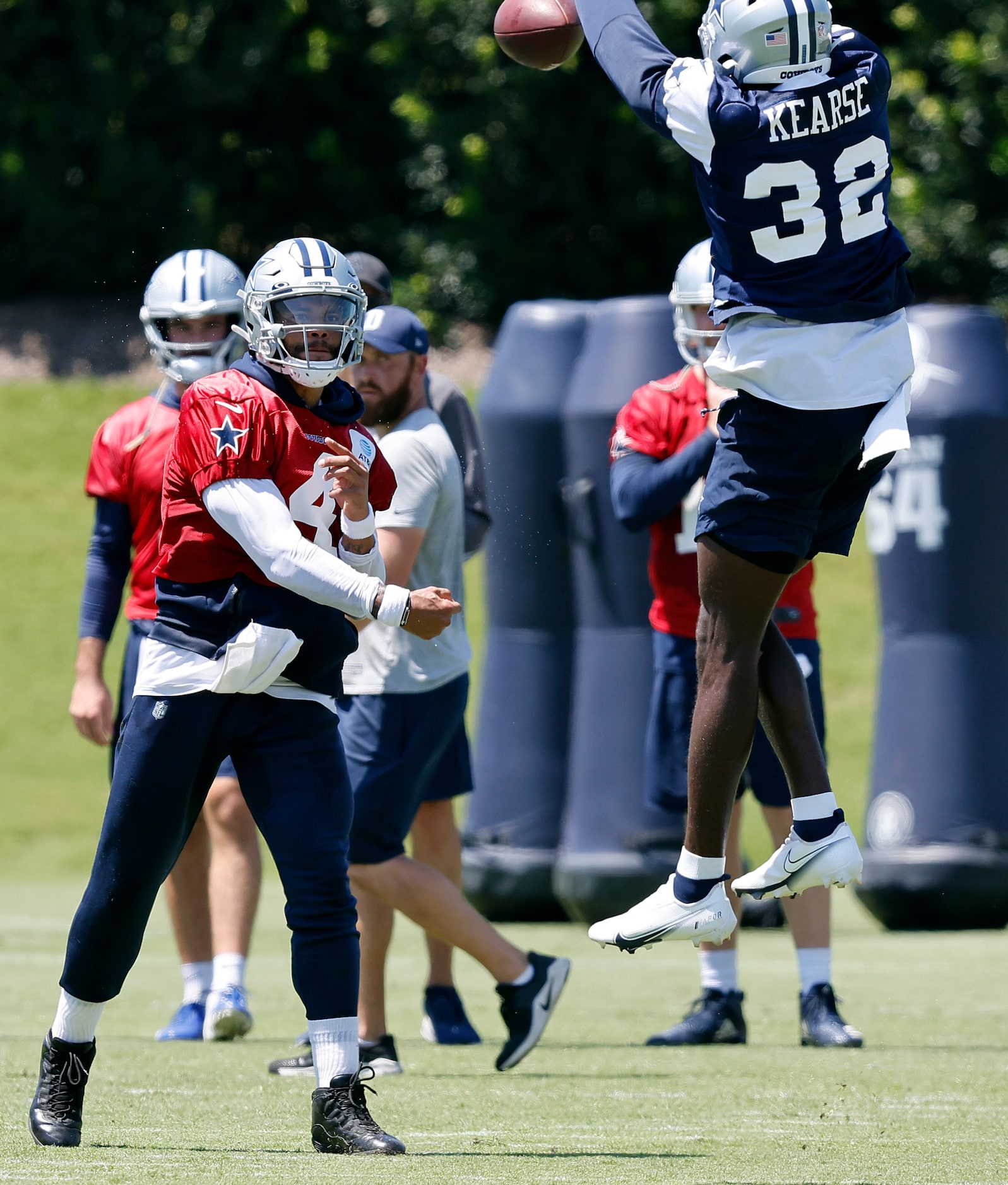 Dallas Cowboys quarterback Dak Prescott (4) attempts to throw over leaping safety Jayron...