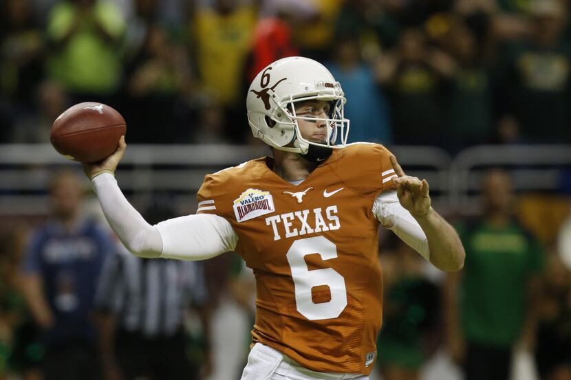 Texas Longhorns quarterback Case McCoy (6) throws a pass during the second half of the...