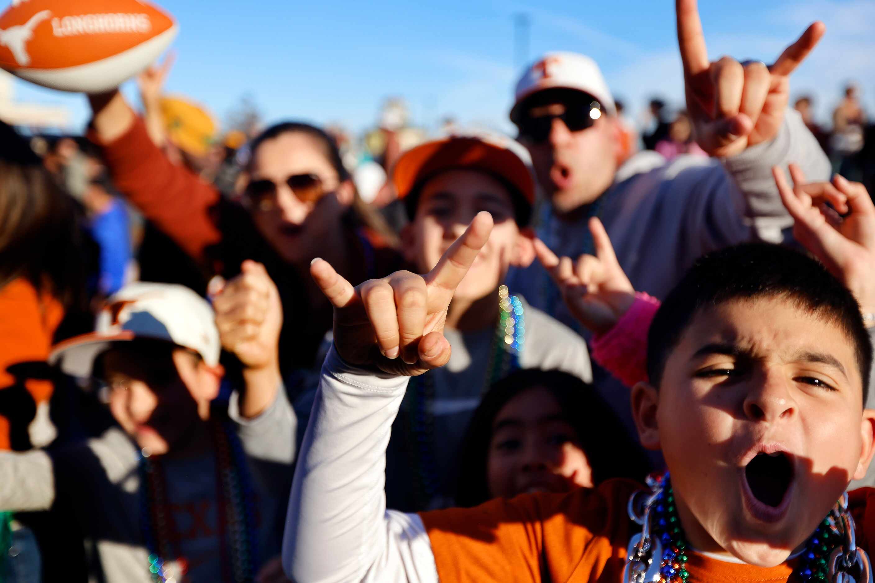Texas Longhorns fans scream along Decatur St  during the Mardi Gras-style Allstate Sugar...